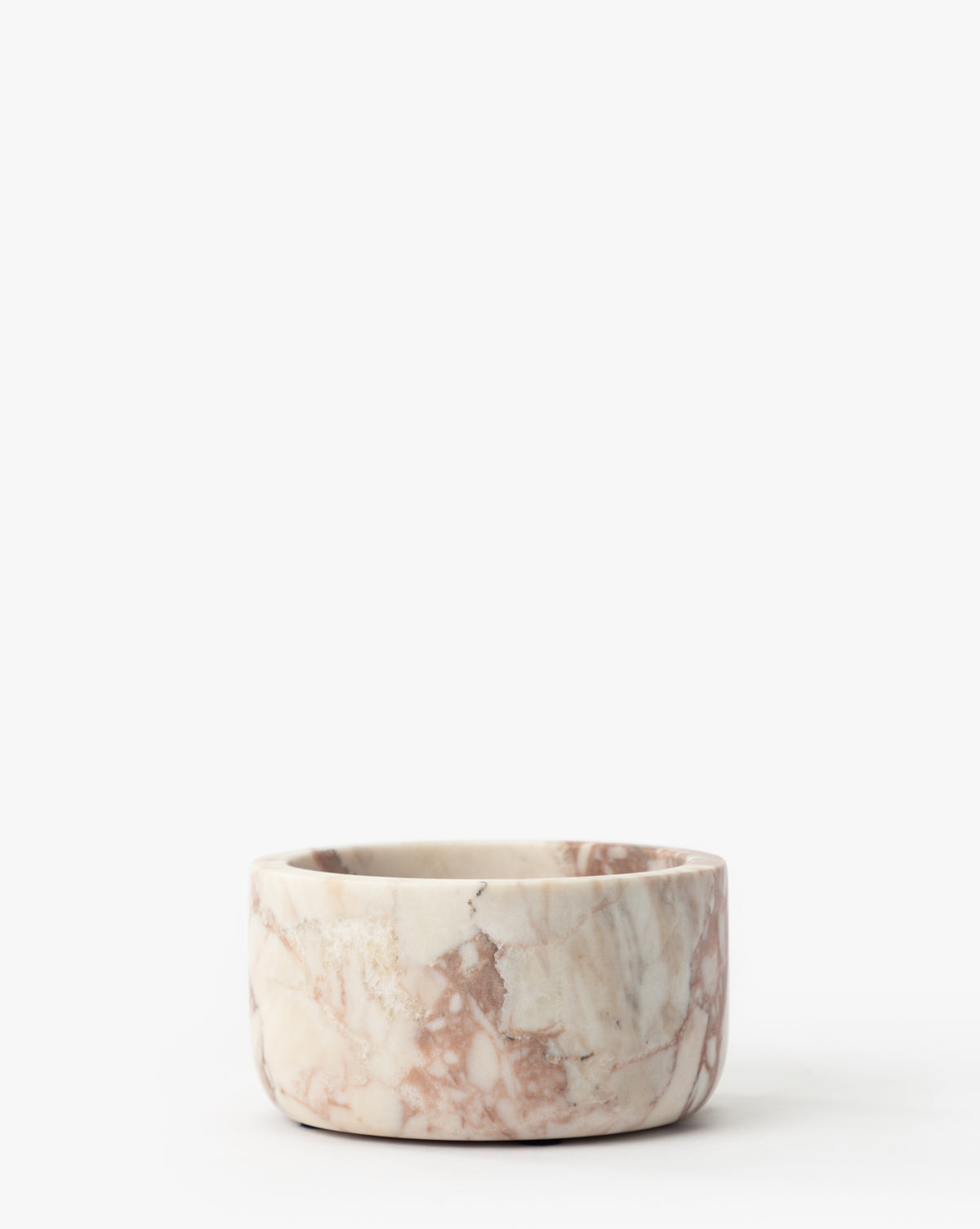 The Verona Marble Bowl is a round, shallow marble bowl with a matte finish and pink, white, and brown veining, displayed against a plain white background by McGee & Co.