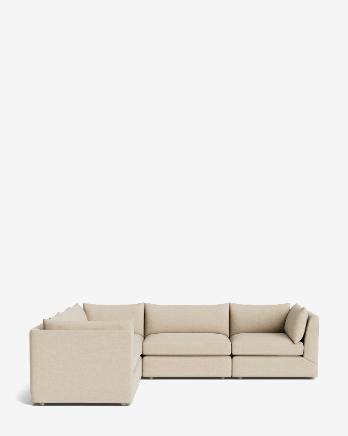 The Makerspalm Vivienne Modular L Sectional is a modern, light beige sofa with low backs and plush seat cushions. Displayed on a white background, its modular pieces form an L-shape for flexible seating options. McGee & Co.