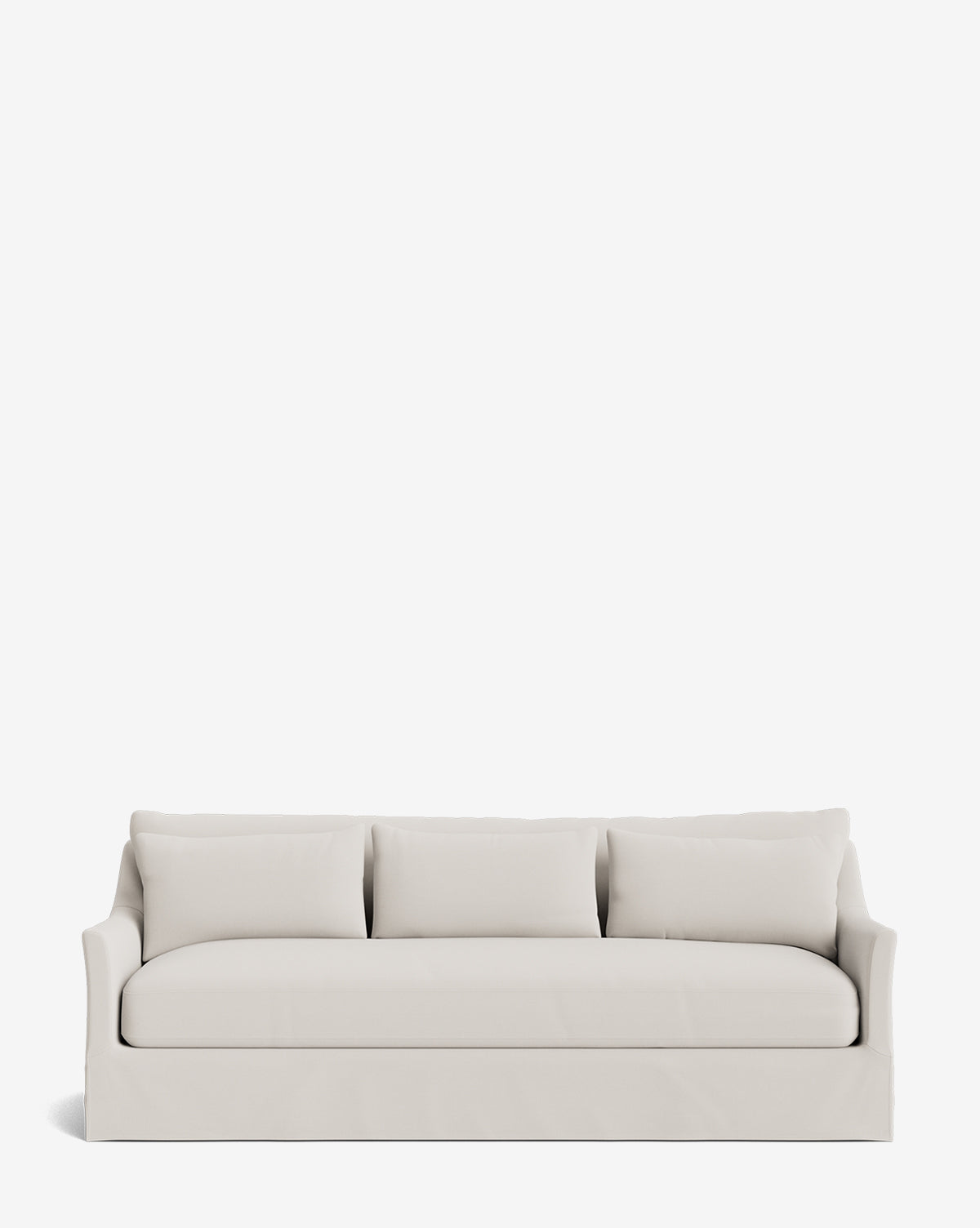 The Wilhelmina Deep Slipcover Sofa (85-110) is a modern, light beige sofa featuring three seat and three back cushions, displayed against a plain white background by McGee & Co.