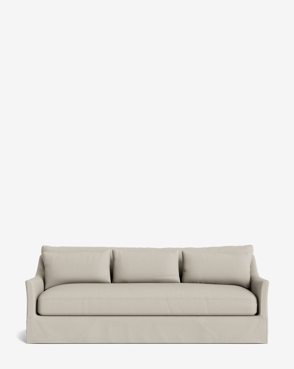 The Wilhelmina Deep Slipcover Sofa (85-110) in beige features three cushions, a skirted base, and slightly flared arms for a luxurious seat, showcased against a plain white background by McGee & Co.
