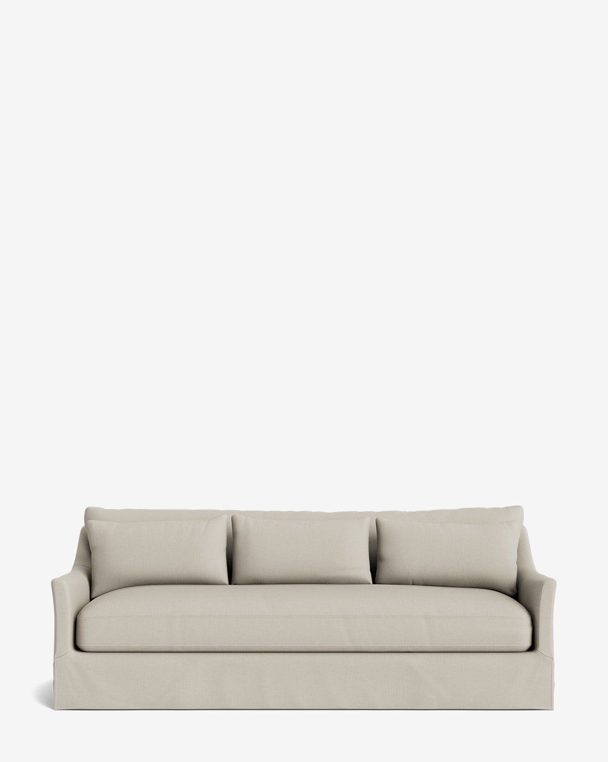 The Wilhelmina Deep Slipcover Sofa (85-110) features a beige upholstered slipcover, three seat cushions, three matching back pillows, slightly flared arms, and a fitted skirt, offering luxurious seating on a plain white background by McGee & Co.