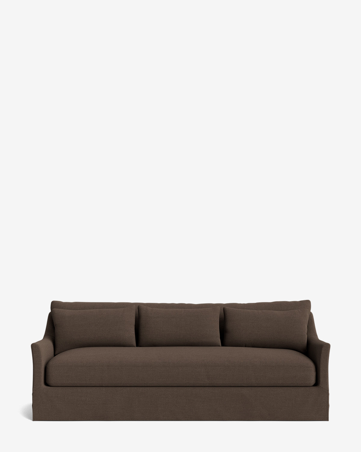 The Wilhelmina Deep Slipcover Sofa (85-110) is a brown, three-seat sofa with deep, plush seats, three back cushions, and a skirted base, shown against a plain white background by McGee & Co.