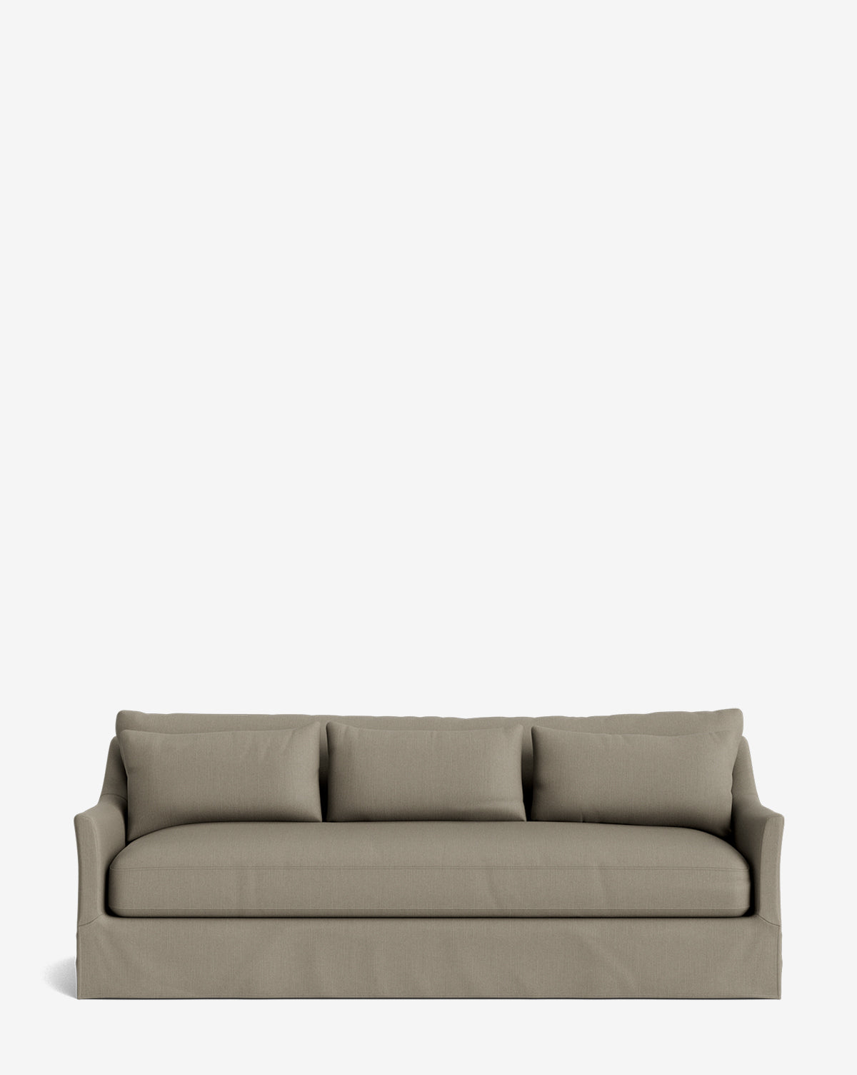 The Wilhelmina Deep Slipcover Sofa (85-110) is a modern, light gray sofa with three seat and back cushions, a skirted base, and slim flared arms, offering a luxurious seating option set against a plain white background by McGee & Co.