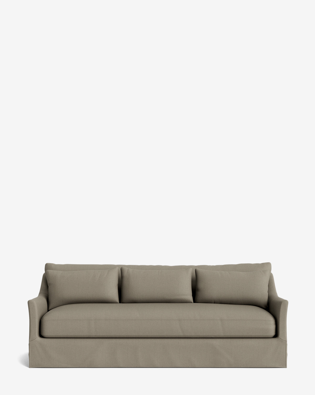 The Wilhelmina Deep Slipcover Sofa (85-110) is a beige, three-seat sofa with three back cushions and a tailored skirt, providing luxurious comfort against a plain white background by McGee & Co.