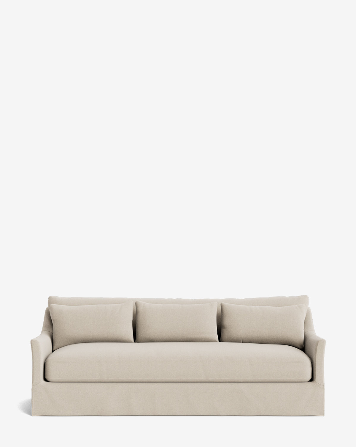 The Wilhelmina Deep Slipcover Sofa (85-110) is a beige three-seater with a skirted base, square arms, and three back cushions, shown on a plain white background by McGee & Co.