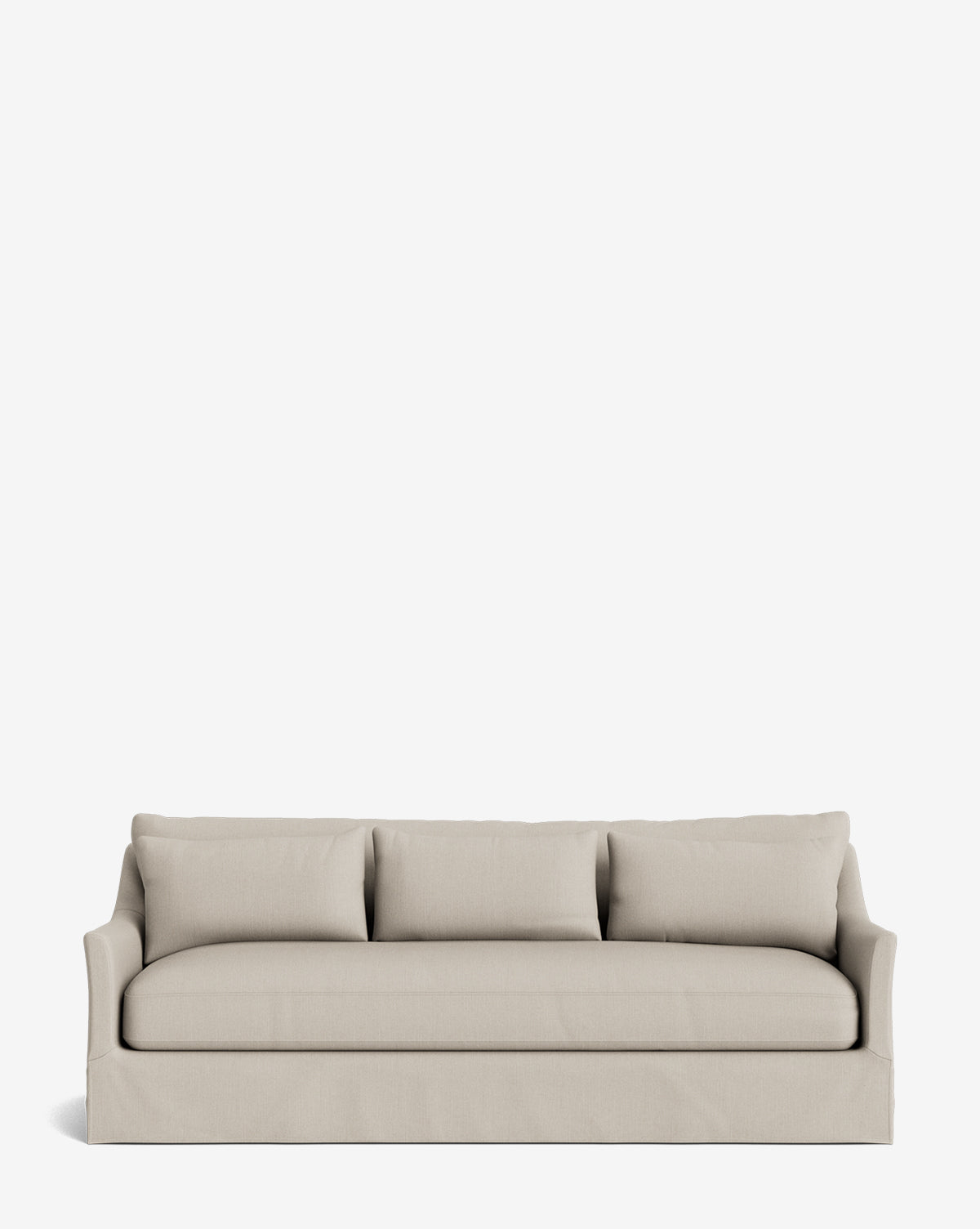 The Wilhelmina Deep Slipcover Sofa (85-110) features a beige slipcover, three seats, three back cushions, and a tailored skirt, offering a luxurious seating option against a plain white background by McGee & Co.
