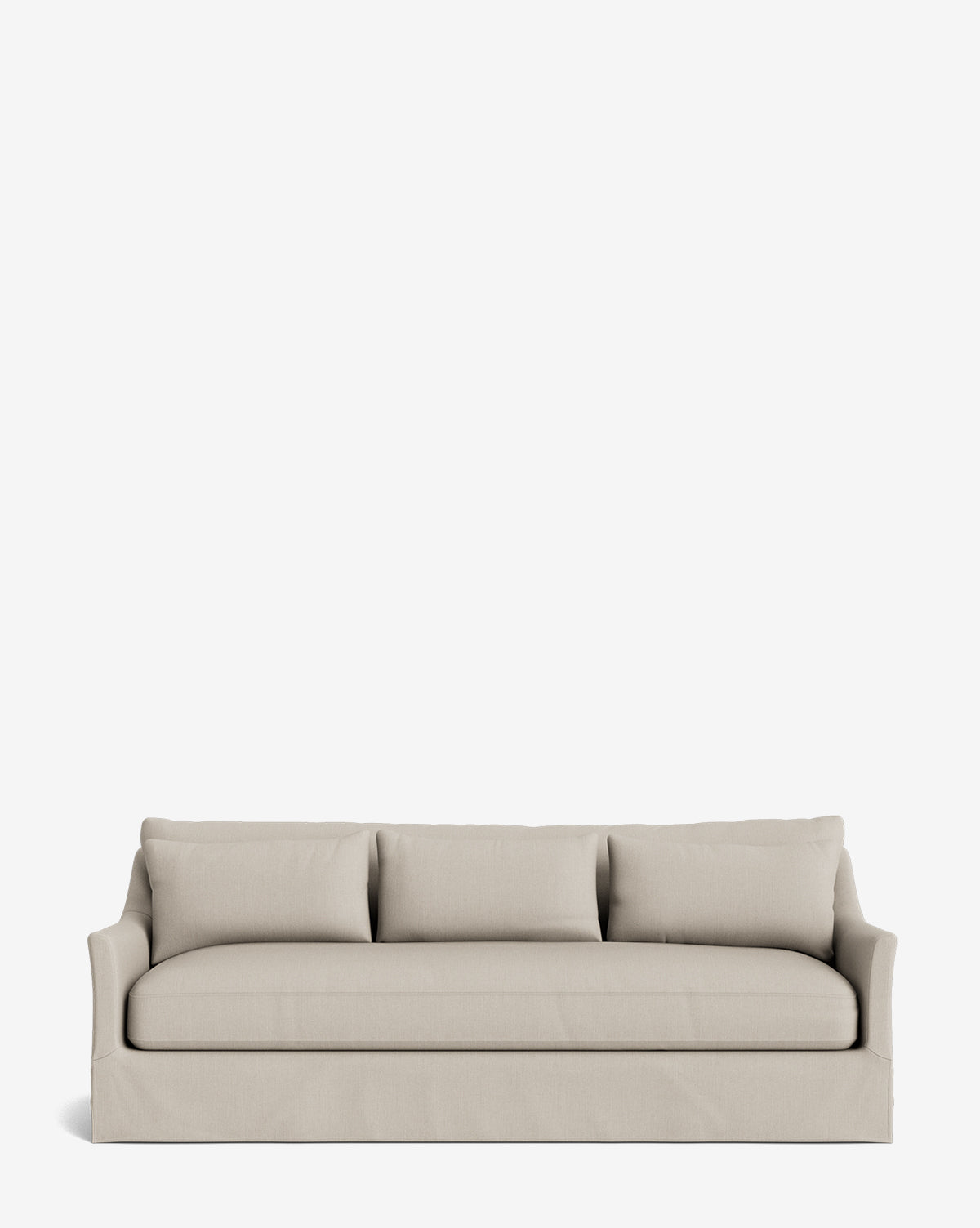 The Wilhelmina Deep Slipcover Sofa (85-110), featuring a beige three-cushion design with a skirted base and curved armrests, sits centered on a white background, showcasing its clean, modern style and luxurious comfort for contemporary spaces, by McGee & Co.