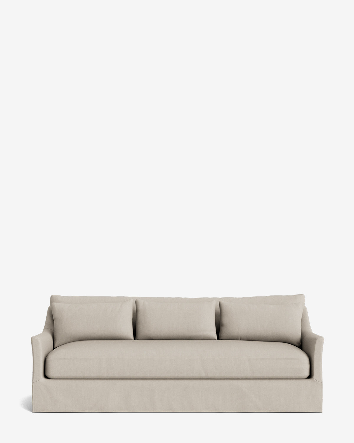 The Wilhelmina Deep Slipcover Sofa (85-110) in beige, featuring three back cushions and a skirted bottom, offers luxurious seating for three and is displayed against a plain white background by McGee & Co.