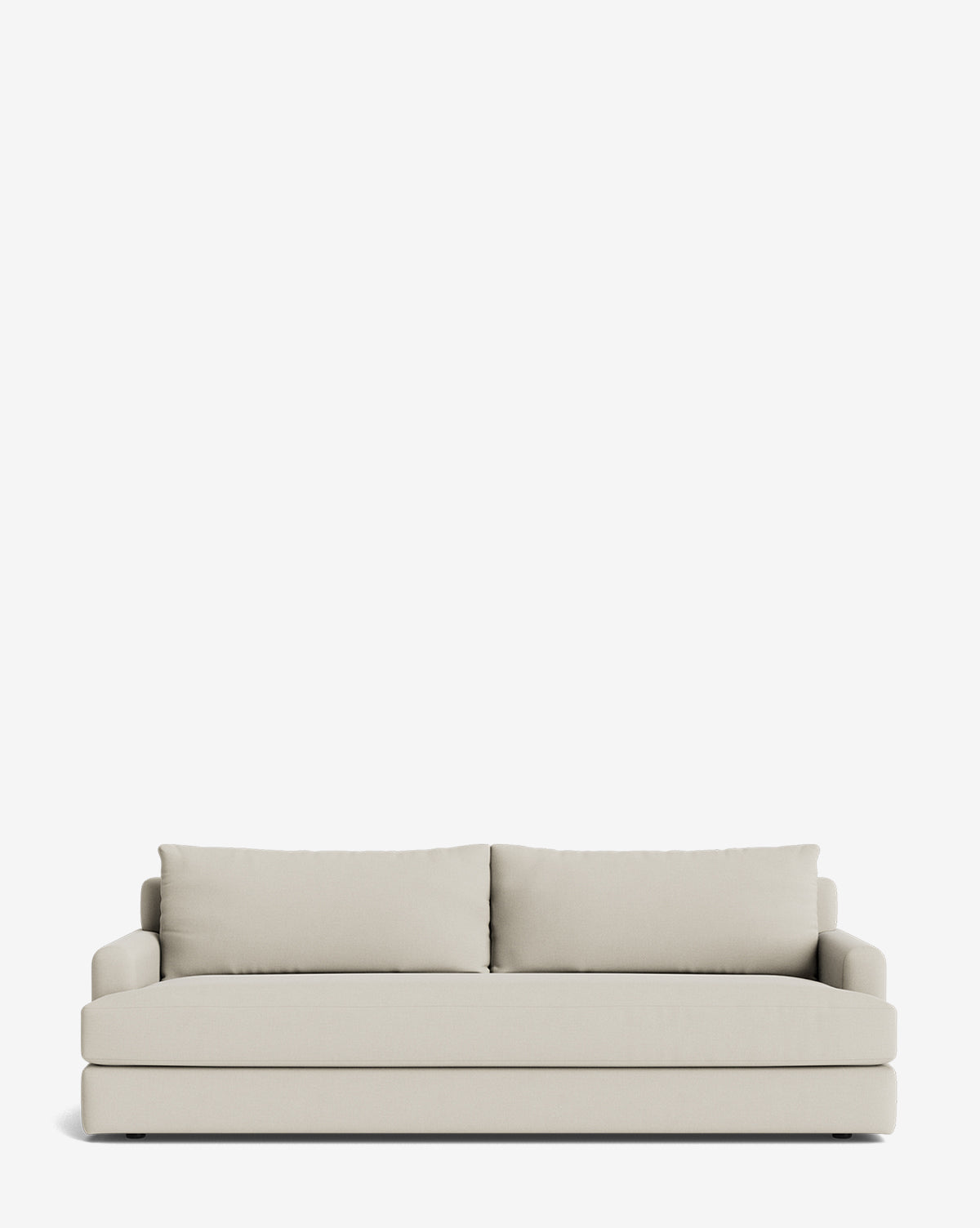 The Winthrop Sofa 90 is a modern, made-to-order beige sofa with two large back cushions and low armrests, shown against a plain white background, by McGee & Co.