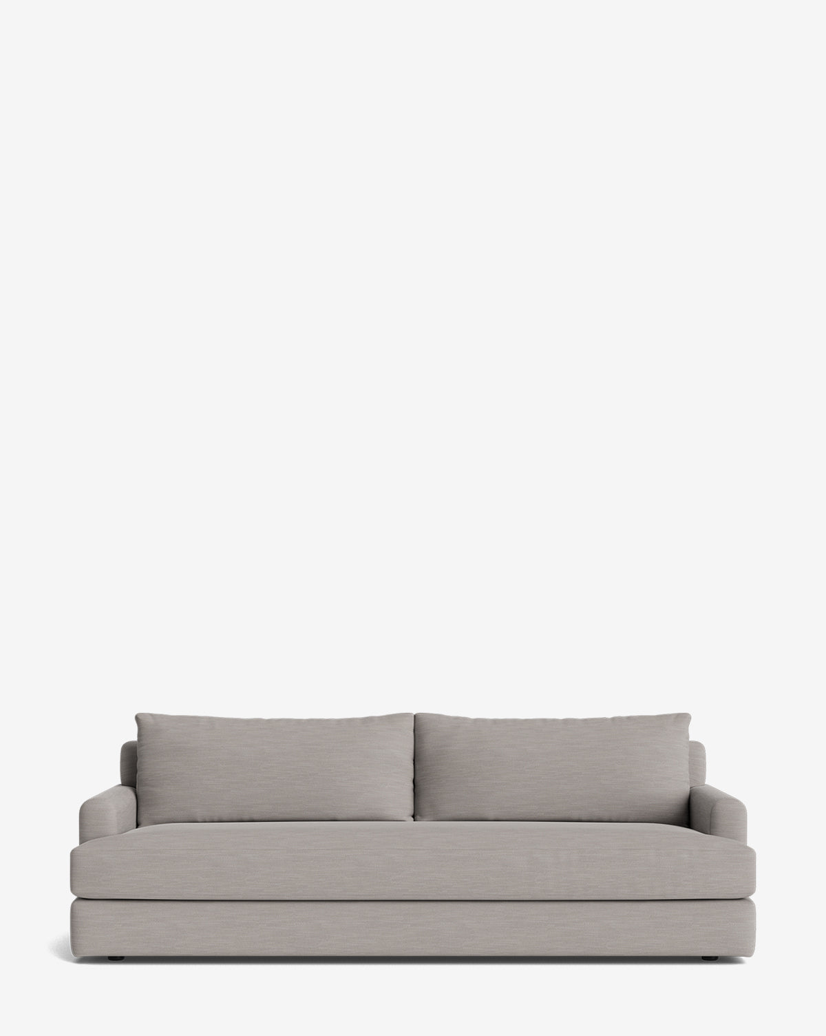 The Winthrop Sofa 90 is a modern, light grey upholstered piece with two large back cushions and low padded arms. Its minimalist, rectangular design is made-to-order and shown against a plain white background, by McGee & Co.