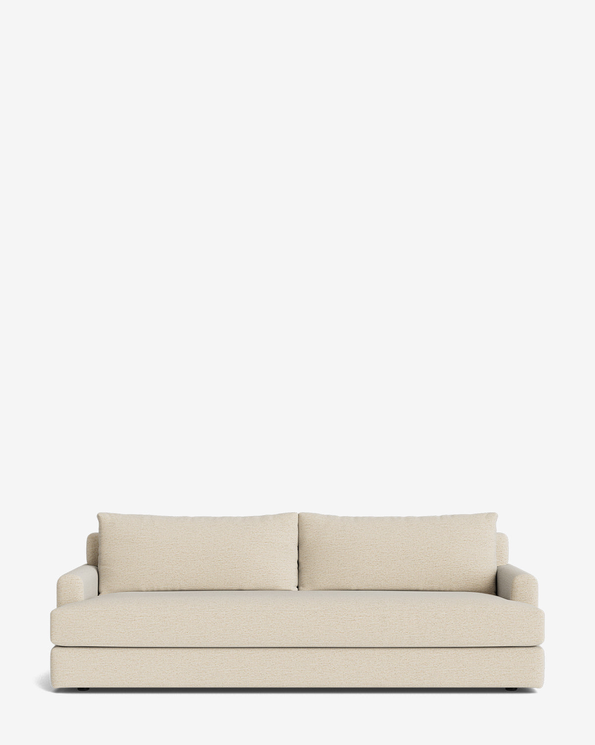 The Winthrop Sofa 90 is a modern beige sofa with two seat cushions, large backrest pillows, and low armrests—its minimalist design makes it ideal as a made-to-order piece set against a plain white background, by McGee & Co.