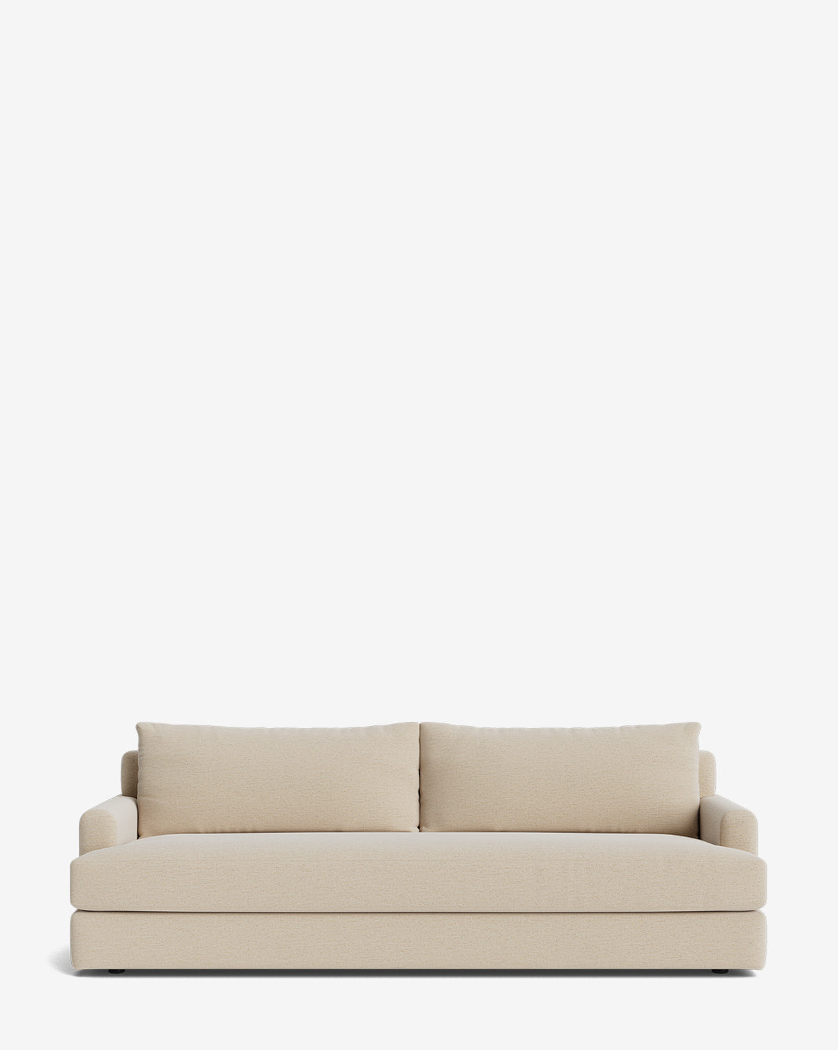 The Winthrop Sofa 90 is a modern, light beige sofa with two back cushions and low, wide arms shown against a plain white background. Its design is simple and contemporary, by McGee & Co.