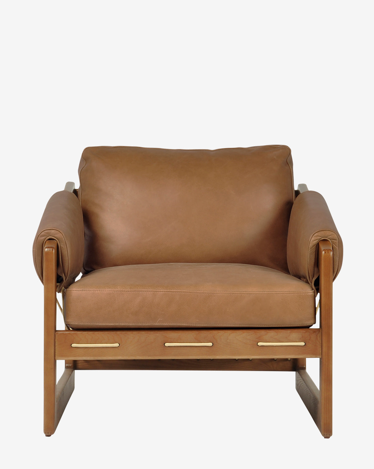 The Barker Lounge Chair features tan top-grain leather cushions, a wooden frame, wide armrests, and a sturdy minimalist design with midcentury inspiration, shown from the front against a plain white background by McGee & Co.
