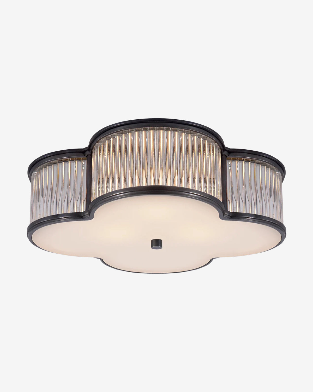 The Basil Flush Mount by Visual Comfort & Co. Signature features a quatrefoil shape, ridged glass sides, a black metal frame, and a frosted glass bottom diffuser. McGee & Co.