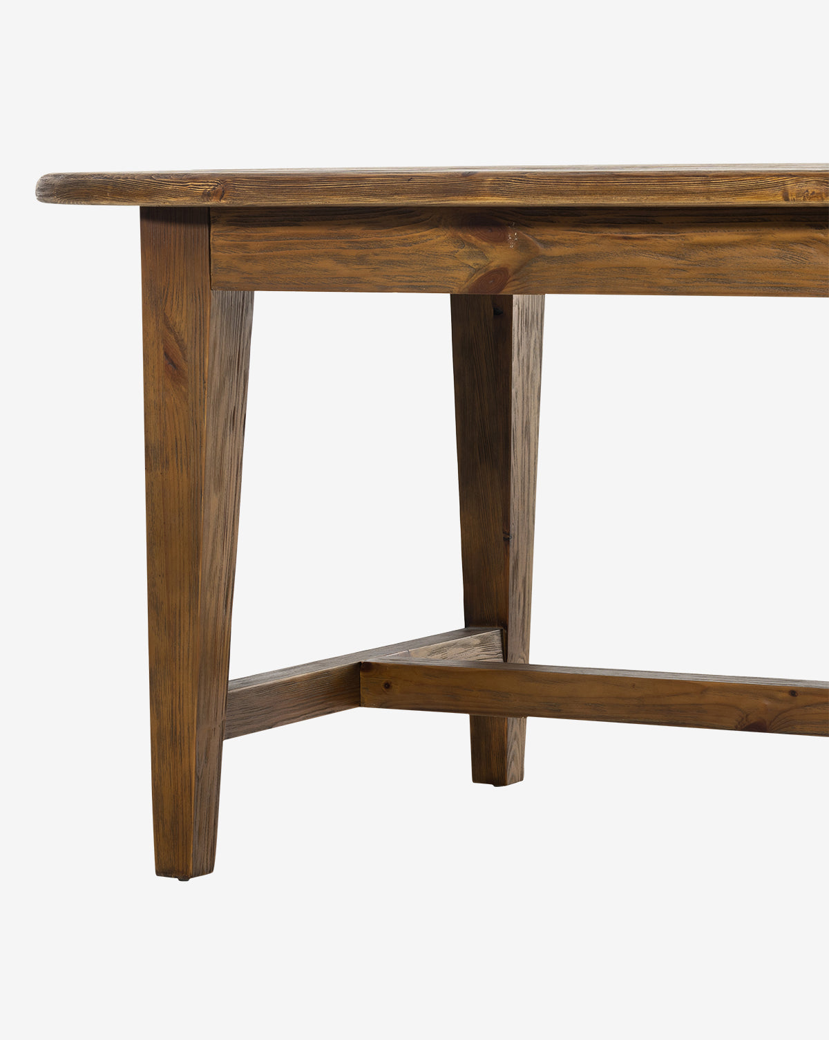 The Constance Dining Table features a rectangular solid pine top with natural wood grain, angled legs, and a crossbar for added stability—an ideal centerpiece for any modern farmhouse dining room, by McGee & Co.