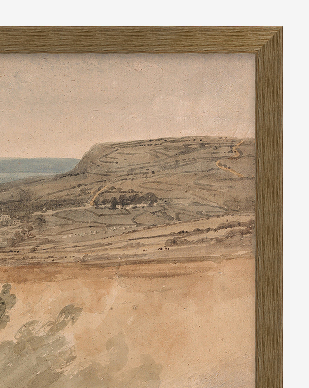The Dorset is a framed watercolor painting with a vintage look, depicting rolling hills, sparse vegetation, and a cloudy sky in muted earth tones. A wooden frame borders the top and right edges of this serene landscape.