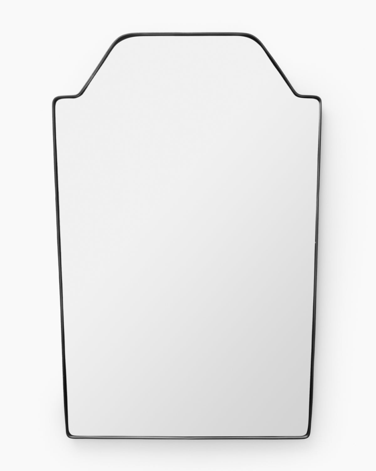 The Giles Wall Mirror is a modern, rectangular mirror with a thin stainless steel border and angled top corners, displayed against a white background, by McGee & Co.