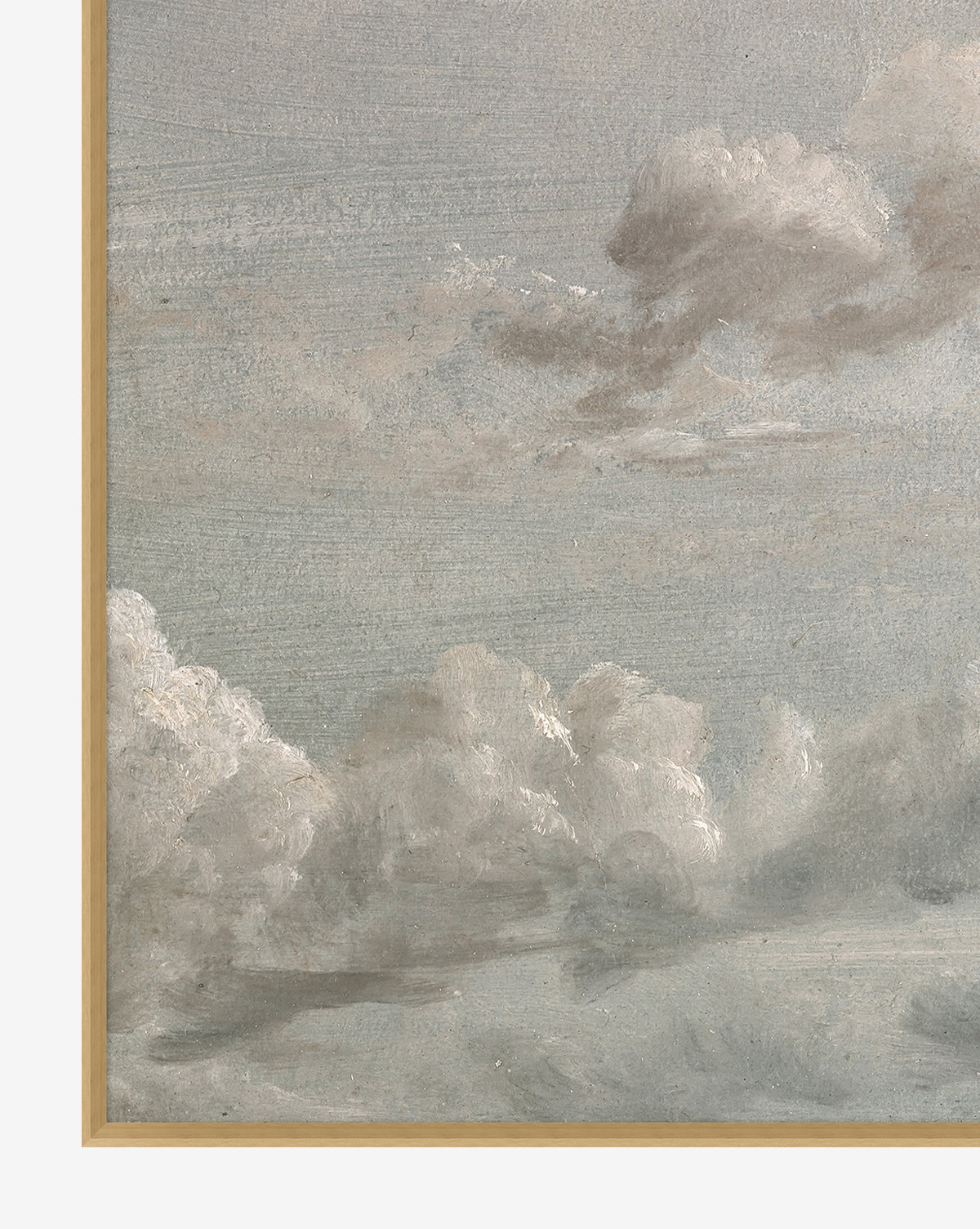 The Gray Clouds wall art features a painting of soft white and gray clouds under a cloudy sky, bordered by a light wooden frame on two edges—ideal for relaxed home decor.