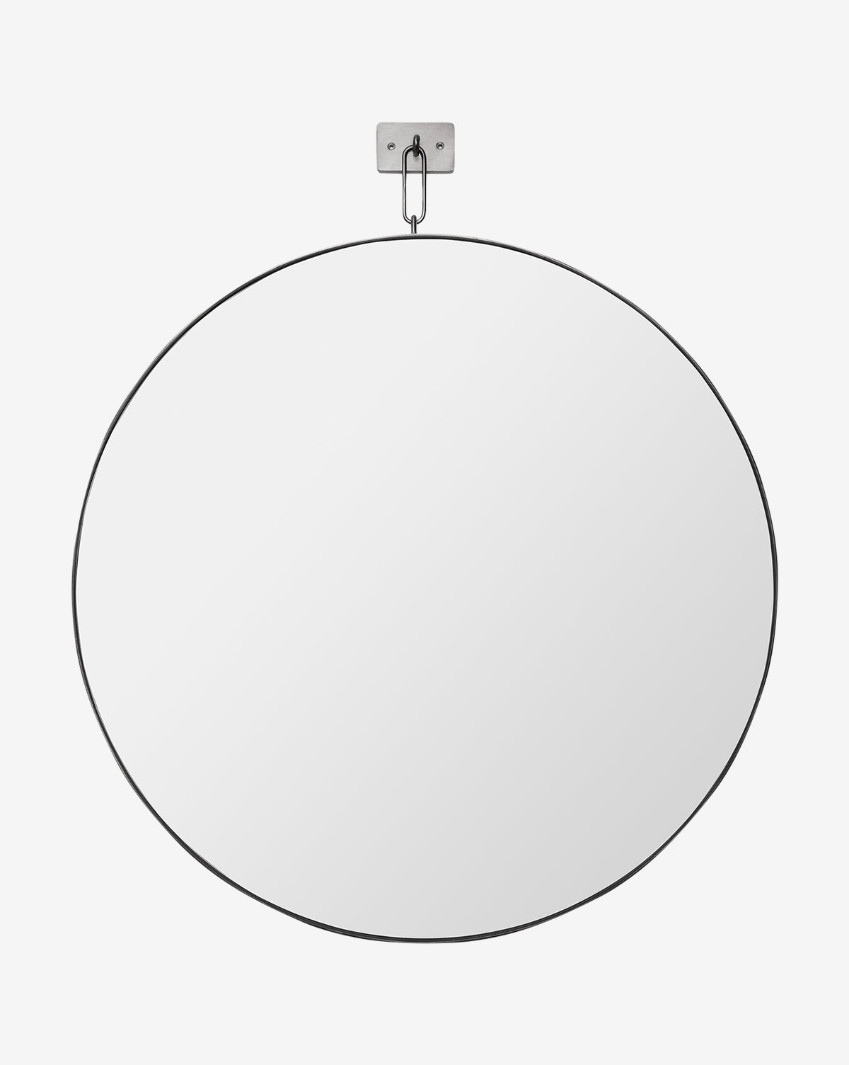 The Haven Wall Mirror, featuring a large, round modern design with a slim black frame, hangs from a small metal bracket and hook against a plain white background, by McGee & Co.