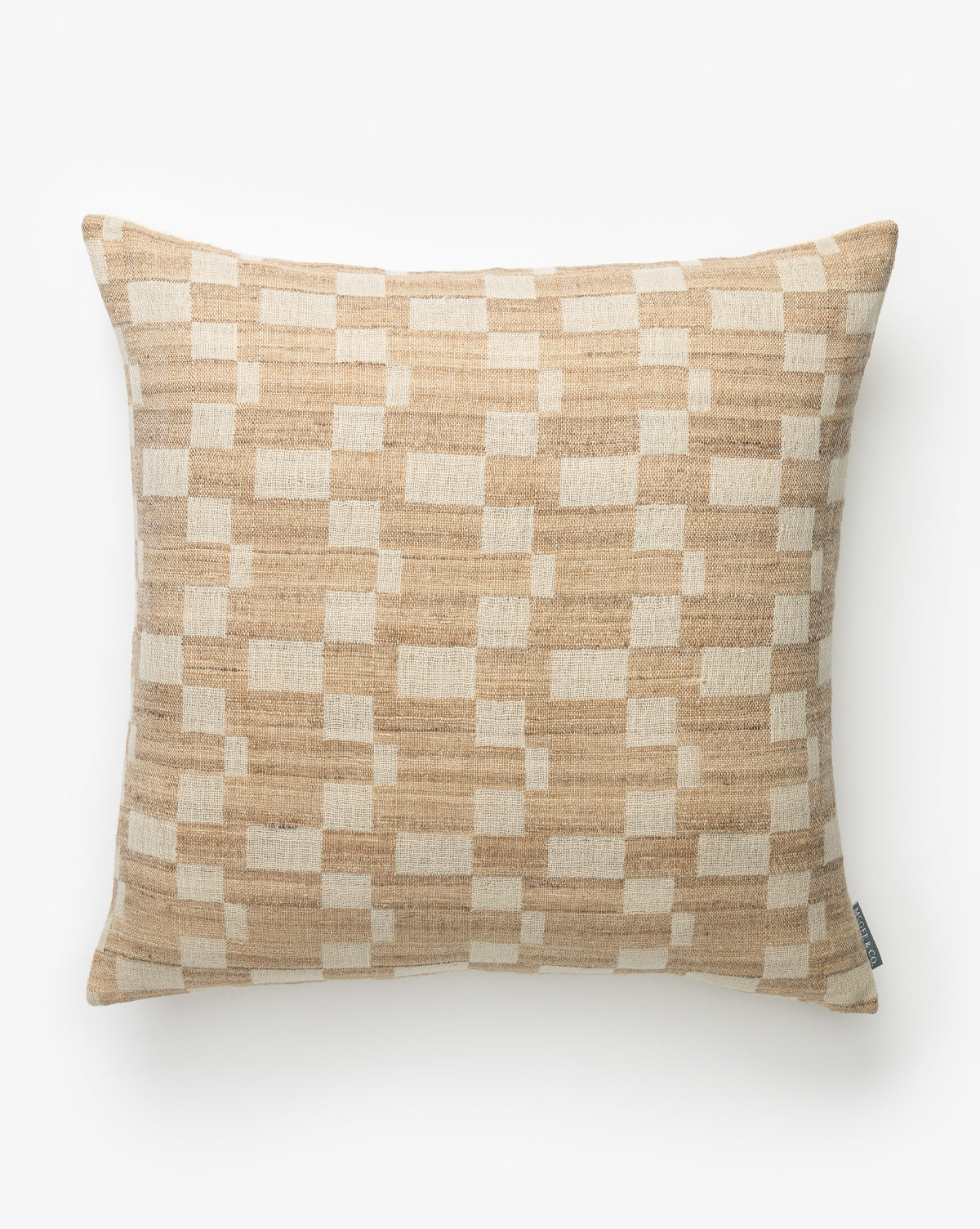 The Hedgerow Pillow Cover features a tan and cream geometric checkered design with interlocking shapes on textured wool, plus a small side tag. The background is plain white, by McGee & Co.