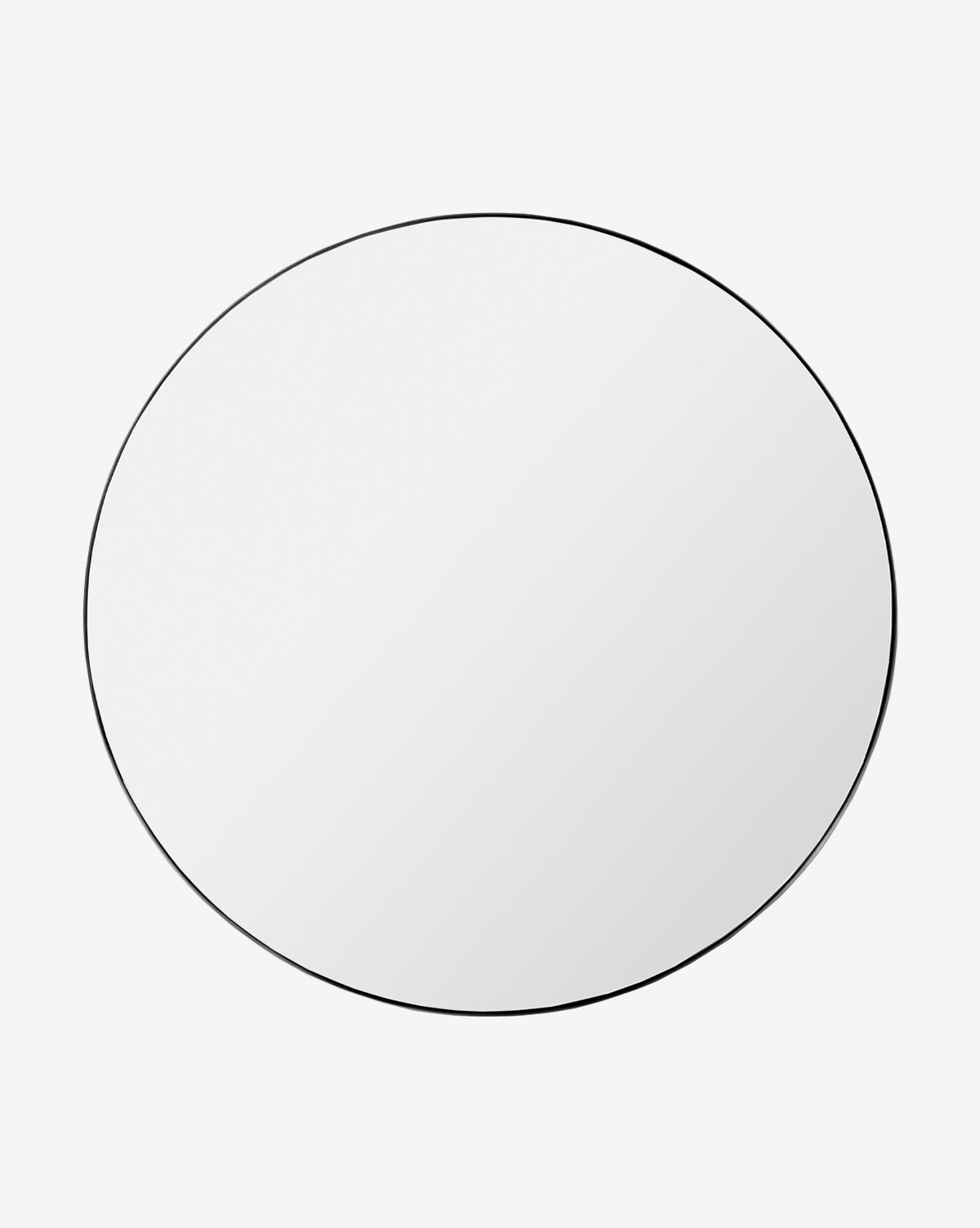 The Jace Inset Circle Mirror features a round, frameless design with shatterproof glass and a slim black border, shown against a plain white background by McGee & Co.