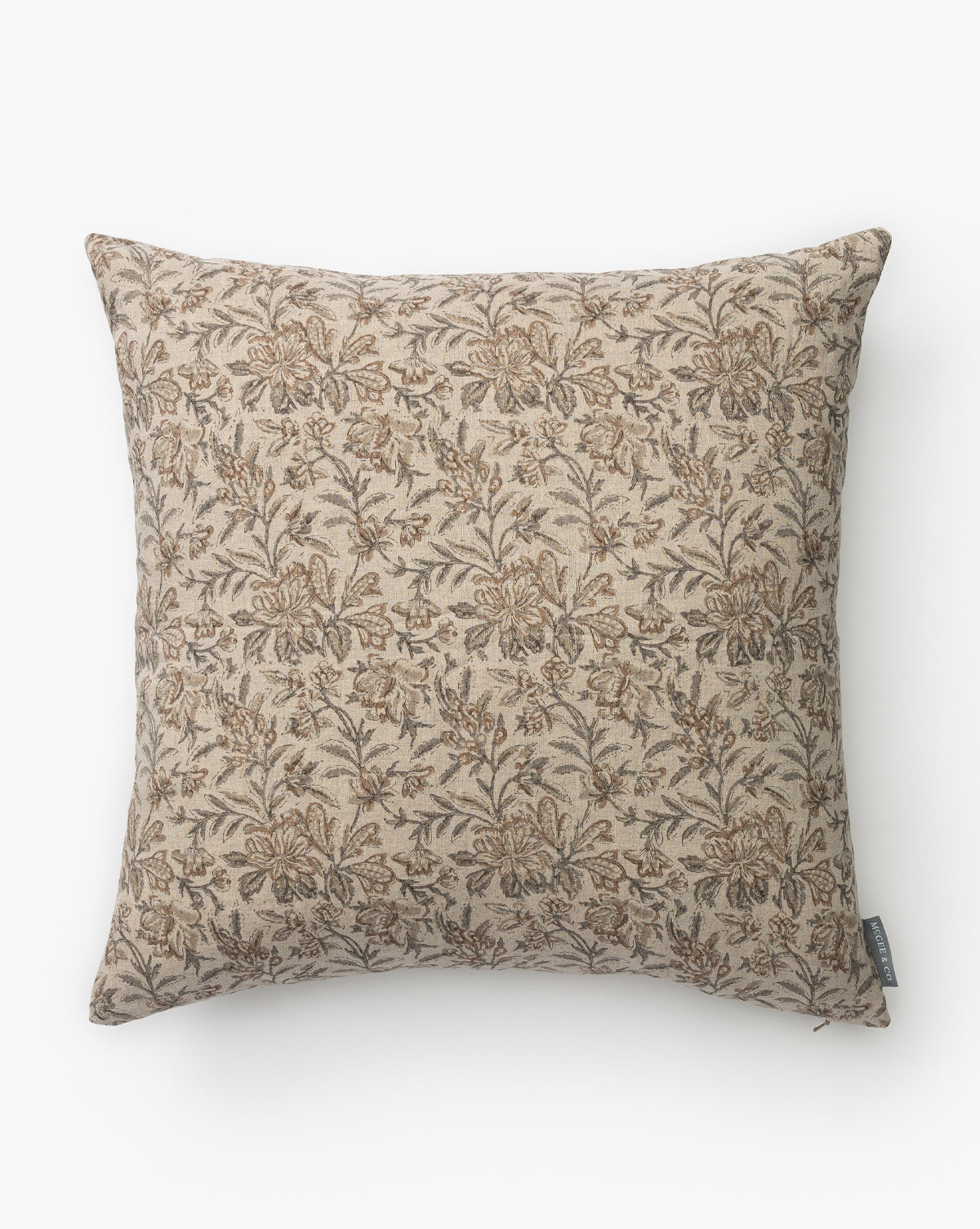 The Lafayette Pillow Cover is a square linen cover with a beige background, detailed brown floral pattern, small side fabric tag, and a classic vintage-inspired design by McGee & Co.