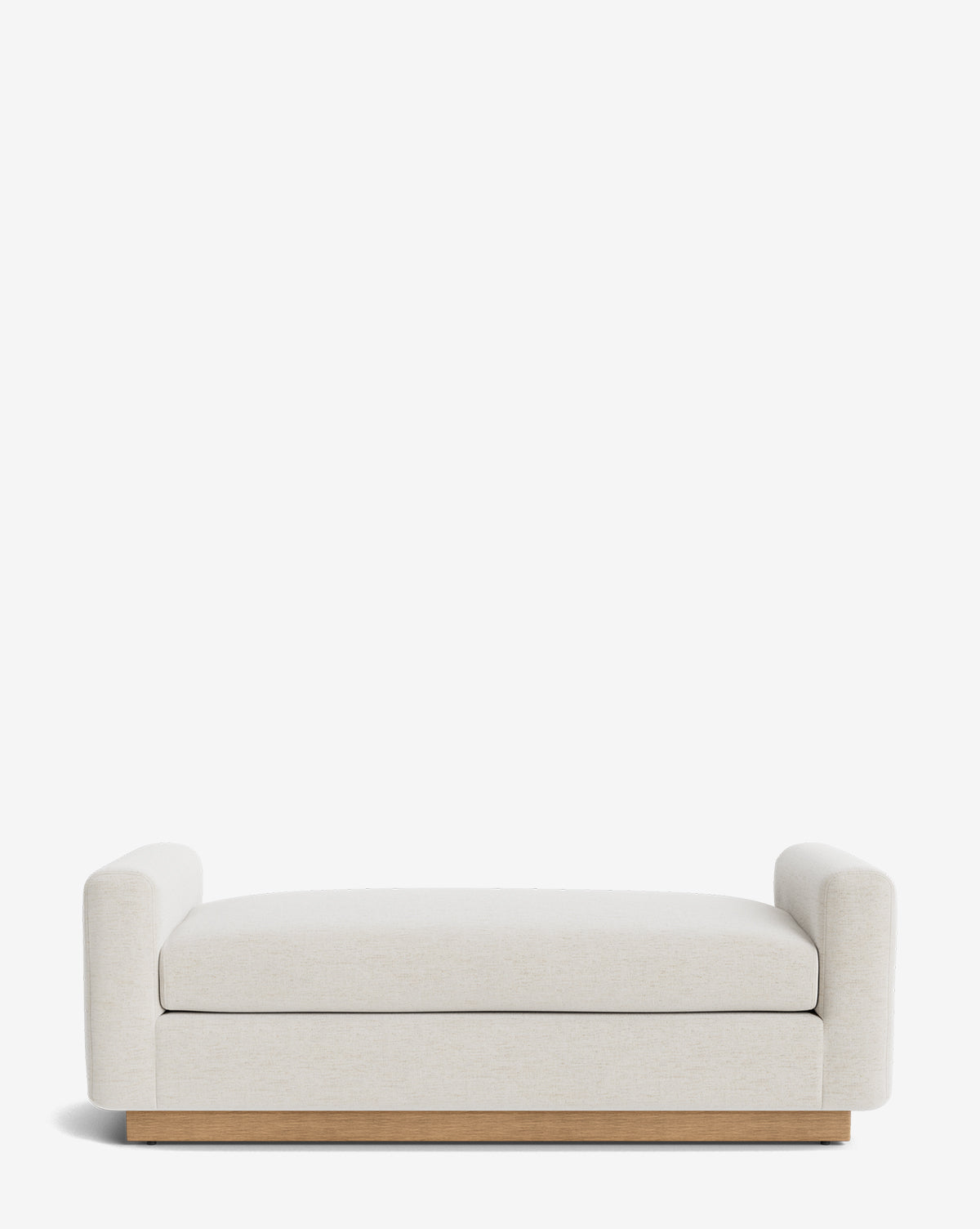 The Community Mansfield Bench features a modern, low-profile design with cream upholstery, cylindrical armrests on both sides, and a wooden base, shown against a plain white background by McGee & Co.