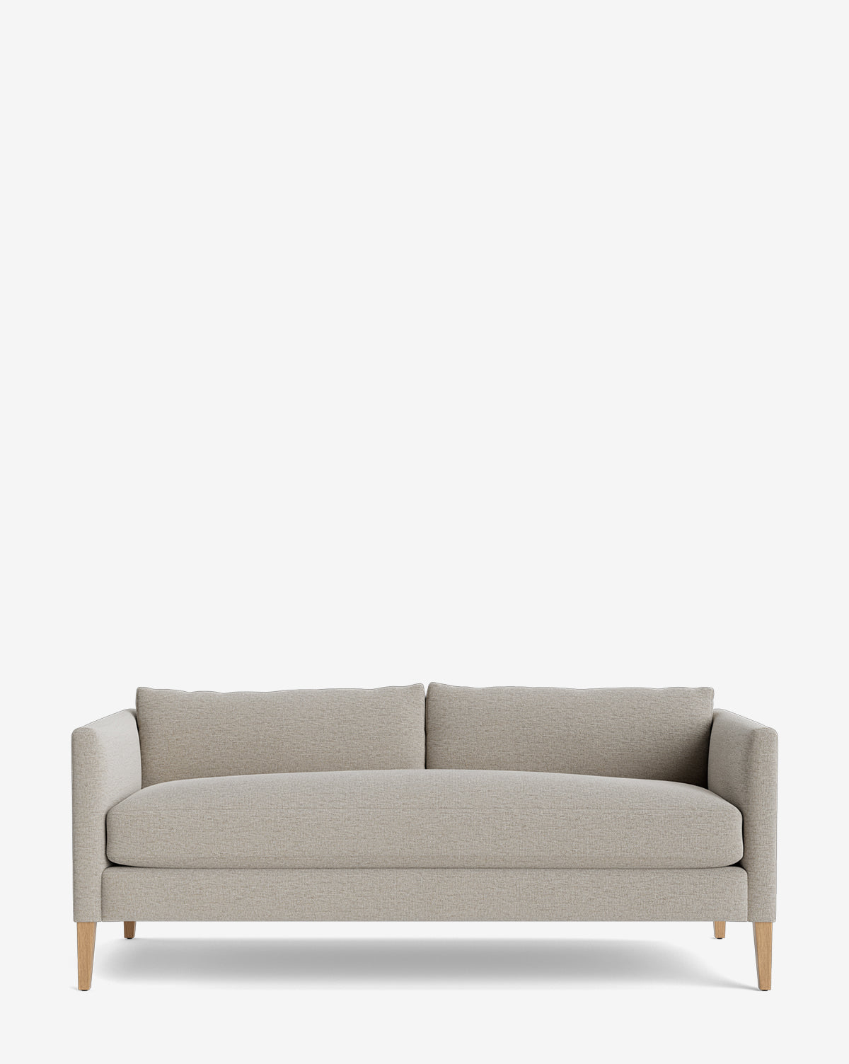 The Cade Sofa 80 (Ready to Ship) features modern, light gray upholstery, clean lines, two seat cushions, a low backrest, and wooden legs in a white oak finish, shown against a plain white background by McGee & Co.