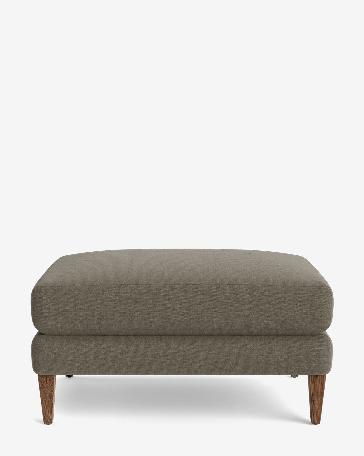 The Lucille Ottoman is a modern, rectangular piece with gray upholstery and wooden legs, displayed on a plain white background, by McGee & Co.
