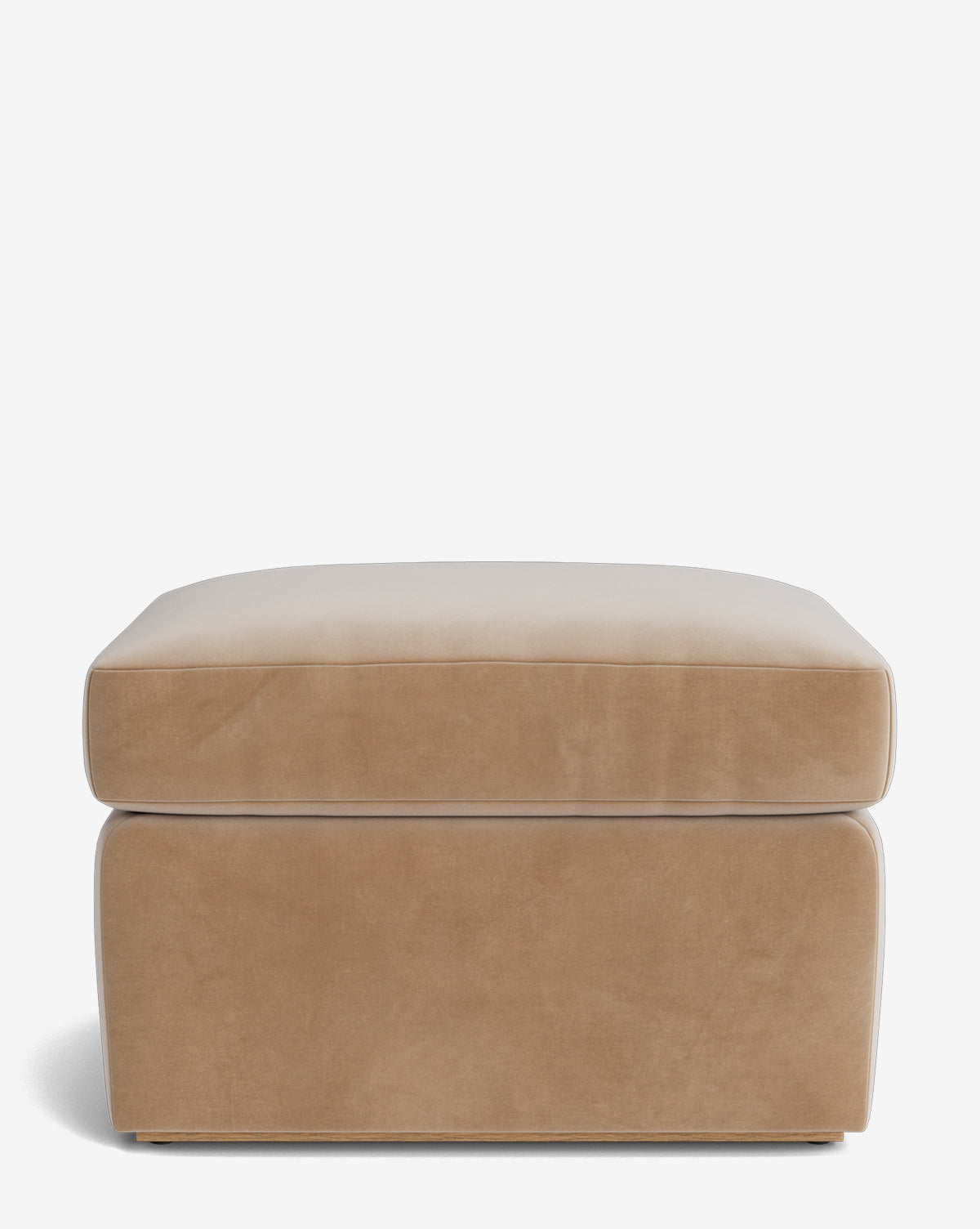 The Reese Ottoman by Community is a beige, rectangular ottoman with smooth upholstery and cushioned sides and top. Its modern, minimalist design offers comfort and style for any space. McGee & Co.
