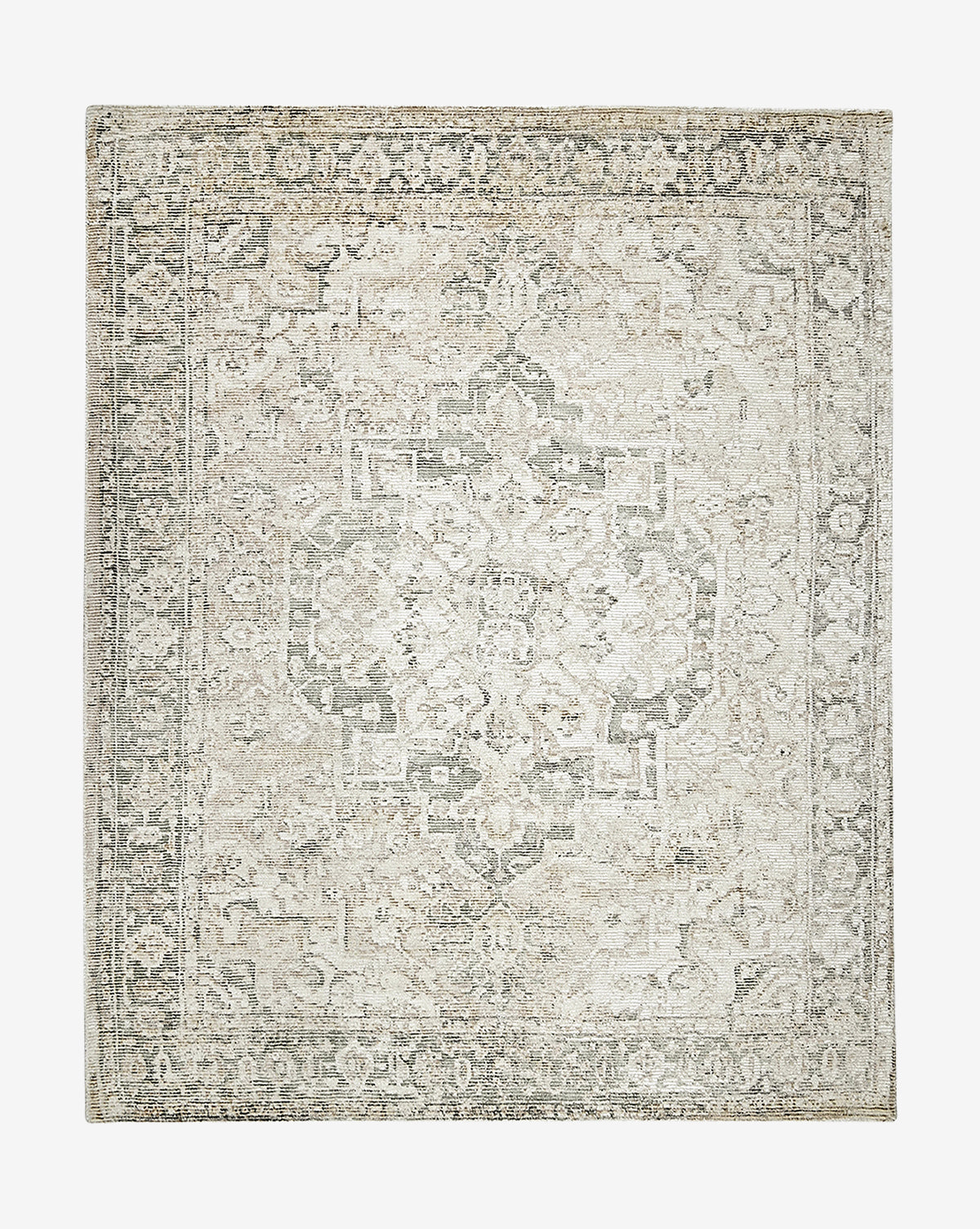 The Shayla Hand-Tufted Rug is a rectangular vintage-style rug with a faded medallion pattern and ornate borders, featuring muted ivory, beige, and gray tones.