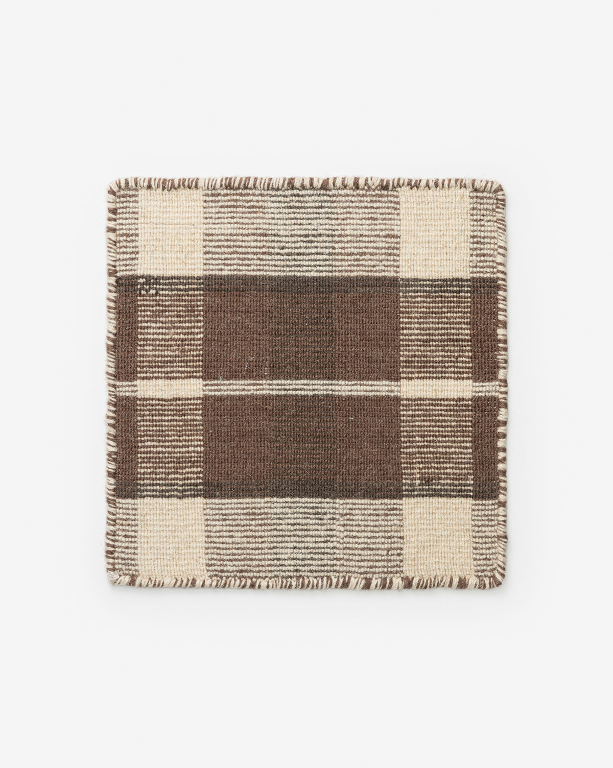 The Orton Rug Swatch is a rectangular, handwoven wool sample with a brown and beige plaid pattern of thick and thin stripes, finished with stitched edges, shown on a white background by McGee & Co.
