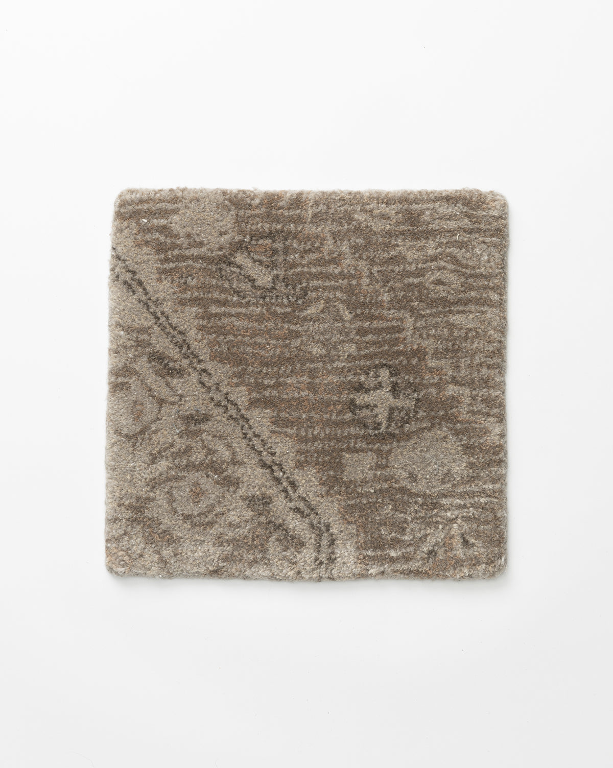Square swatch of the Siyara Hand-Tufted Wool Rug in brown and beige, featuring a subtle abstract pattern with diagonal lines, displayed on a white background—crafted for style and durability, by McGee & Co.