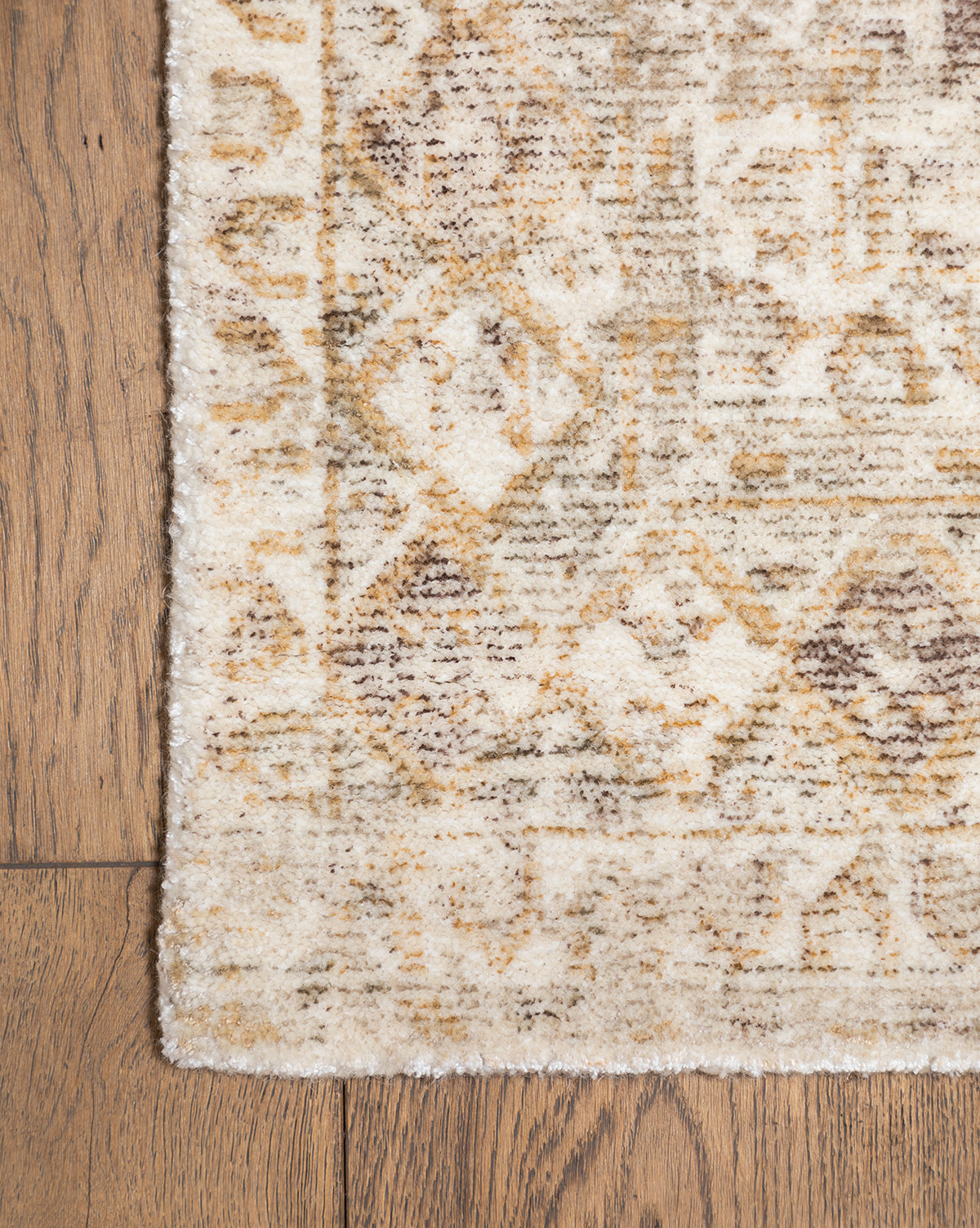 The image highlights a corner of the rug with its distinct geometric design, by McGee & Co.