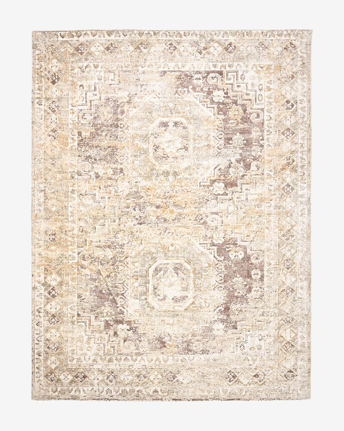 The Marcella Handwoven Rug is a rectangular neutral tan rug with a faded geometric and floral pattern in beige, cream, and light brown, featuring octagonal medallions and a decorative border, by McGee & Co.