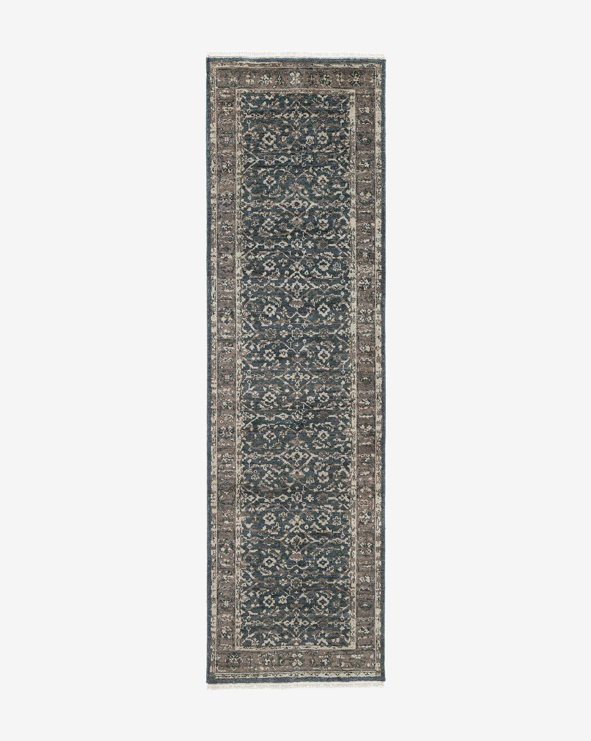 The Marta Hand-Knotted Wool Rug is a rectangular wool rug with an intricate traditional pattern in dark blue, brown, and beige, detailed borders, and a symmetrical central design, by McGee & Co.