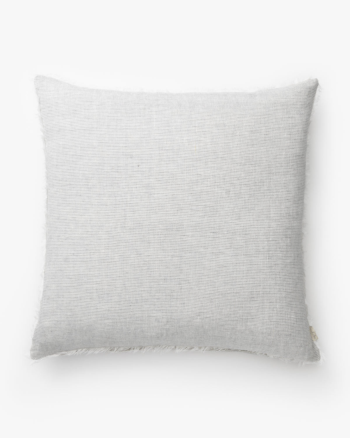The McCallen Pillow is a rectangular, light gray linen pillow with soft textured fabric and a subtle fringe edge, shown on a plain white background by McGee & Co.
