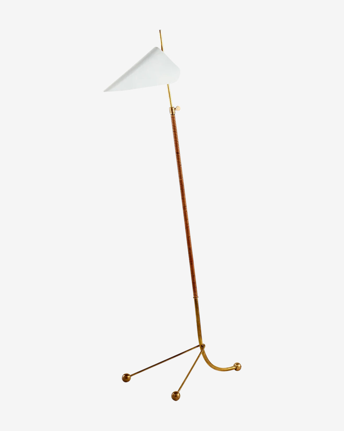 The Moresby Floor Lamp features a thin brass stand, a leather-wrapped middle section, a white triangular shade, and an elegant tripod base with three round brass feet for modern lighting style, by McGee & Co.