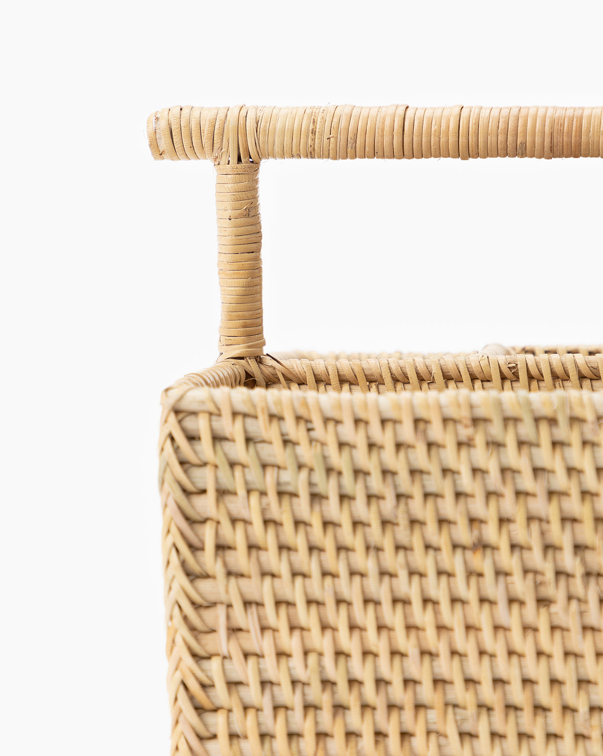 Close-up of the Rattan Utensil Caddy, featuring a rectangular woven design and sturdy handle, ideal as an organizer, displayed against a plain white background, by McGee & Co.