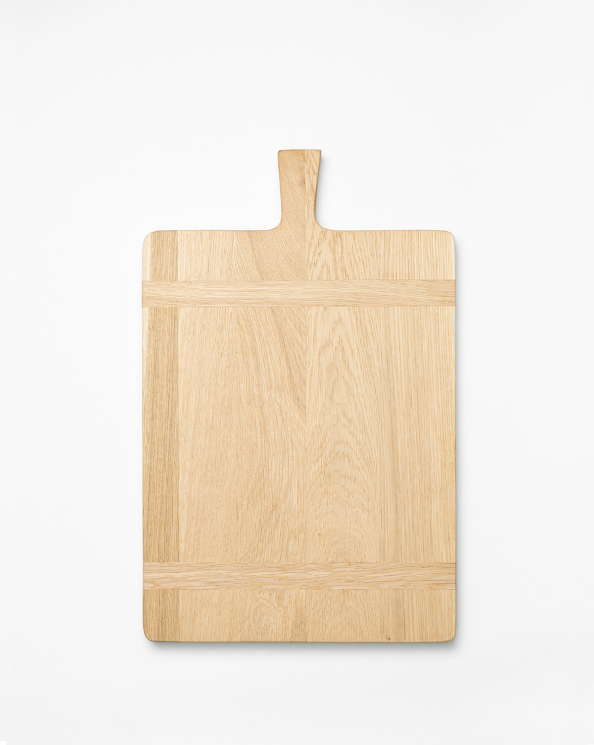 The Rectangle Bread Board, made from oak and walnut with a handle, features a natural finish that showcases the wood grain and clean lines. It is photographed on a white background by McGee & Co.