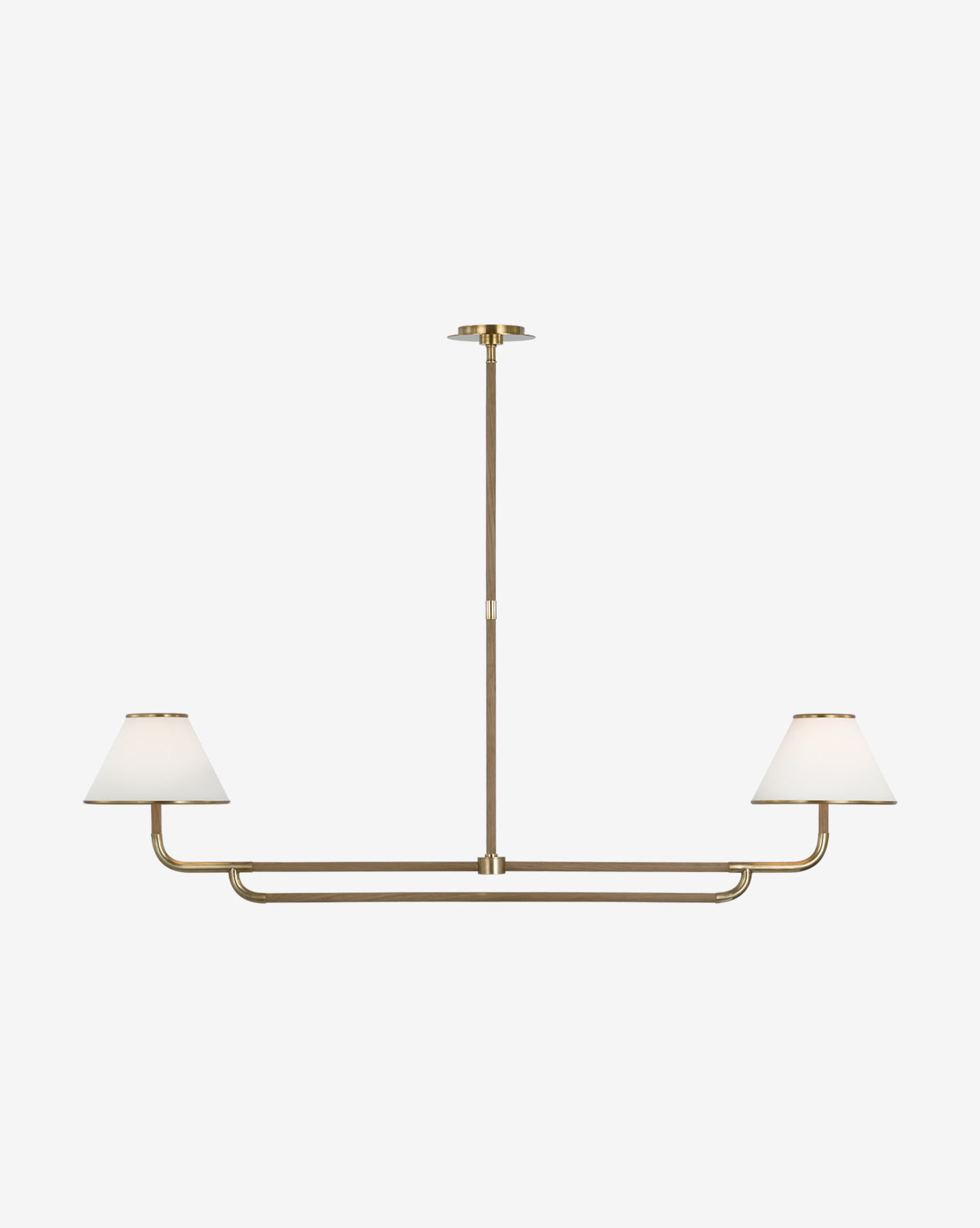 The Rigby Linear Chandelier by Visual Comfort & Co. Signature features two white linen fabric shades on a sleek brass bar, elegantly suspended from the ceiling for a modern touch by McGee & Co.