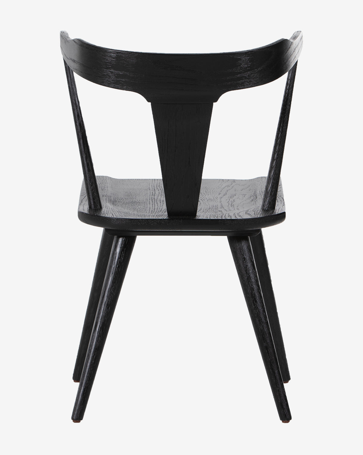 The Ruthie Dining Chair, shown from behind, features a modern black finish with a curved backrest, central vertical support, and angled legs. Its minimalist design highlights clean lines and a smooth surface.