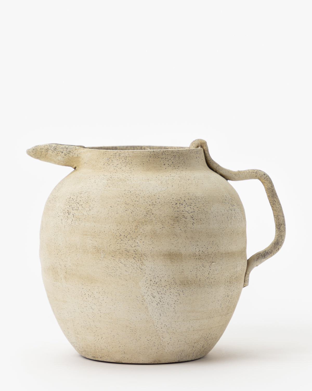 The Weathered Ceramic Jug features a rustic, vintage beige finish with a round body, short left spout, and curved right handle—ideal as an accent piece against any plain white background.