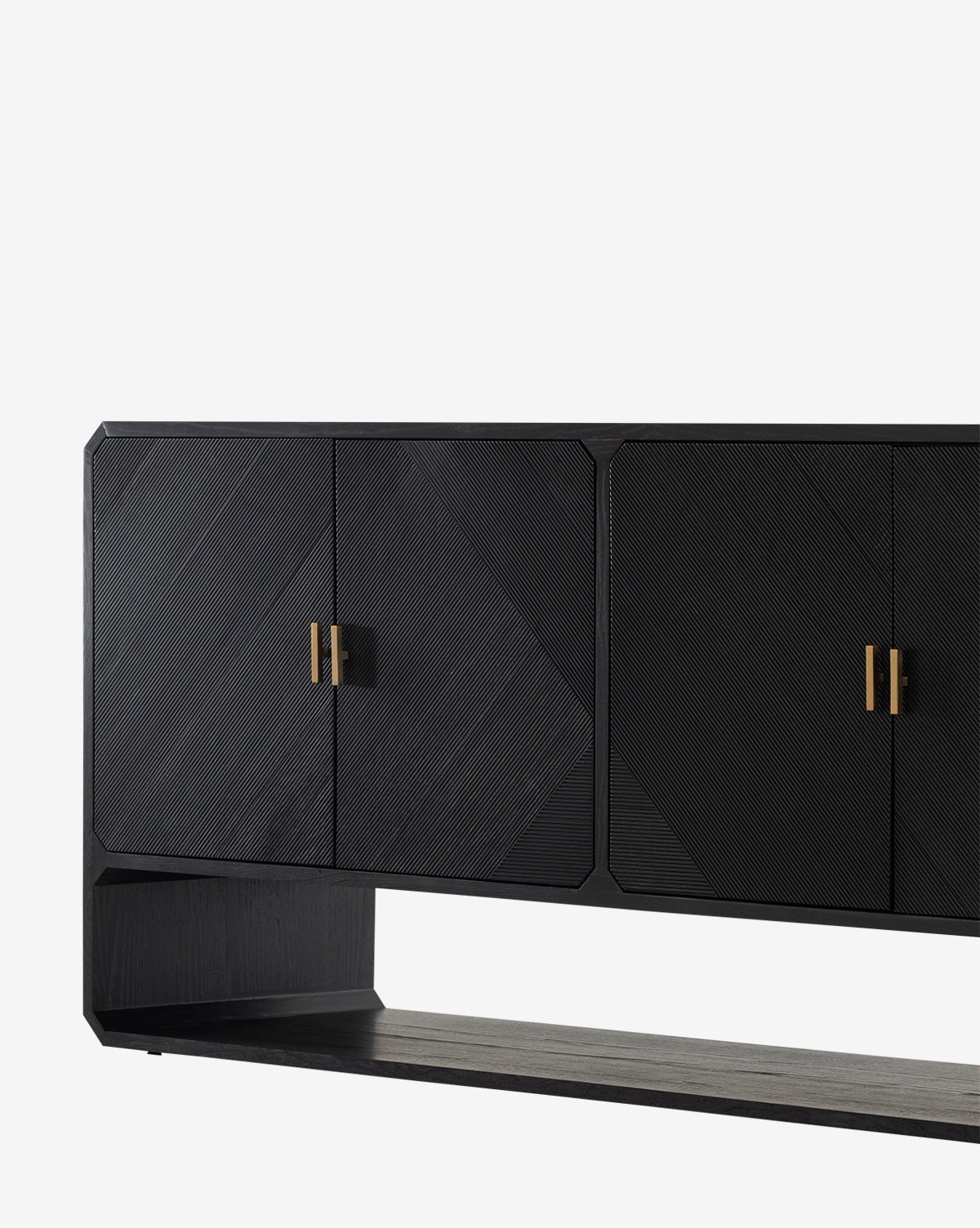 The Ziggy Sideboard, crafted in black ash veneer, features geometric textured doors with gold handles and a rectangular open base, displayed against a plain white background by McGee & Co.