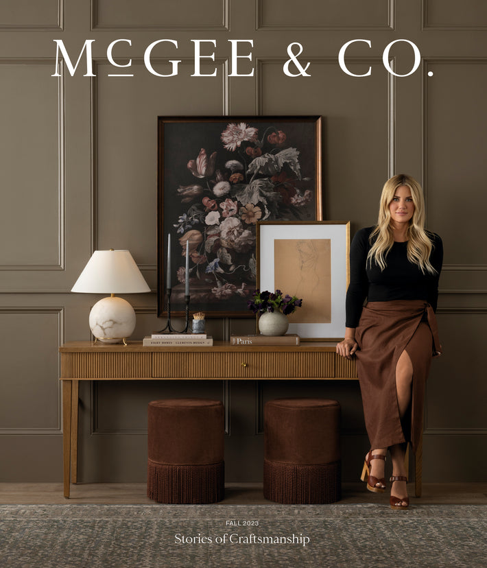Shea McGee standing by some of the fall collection items