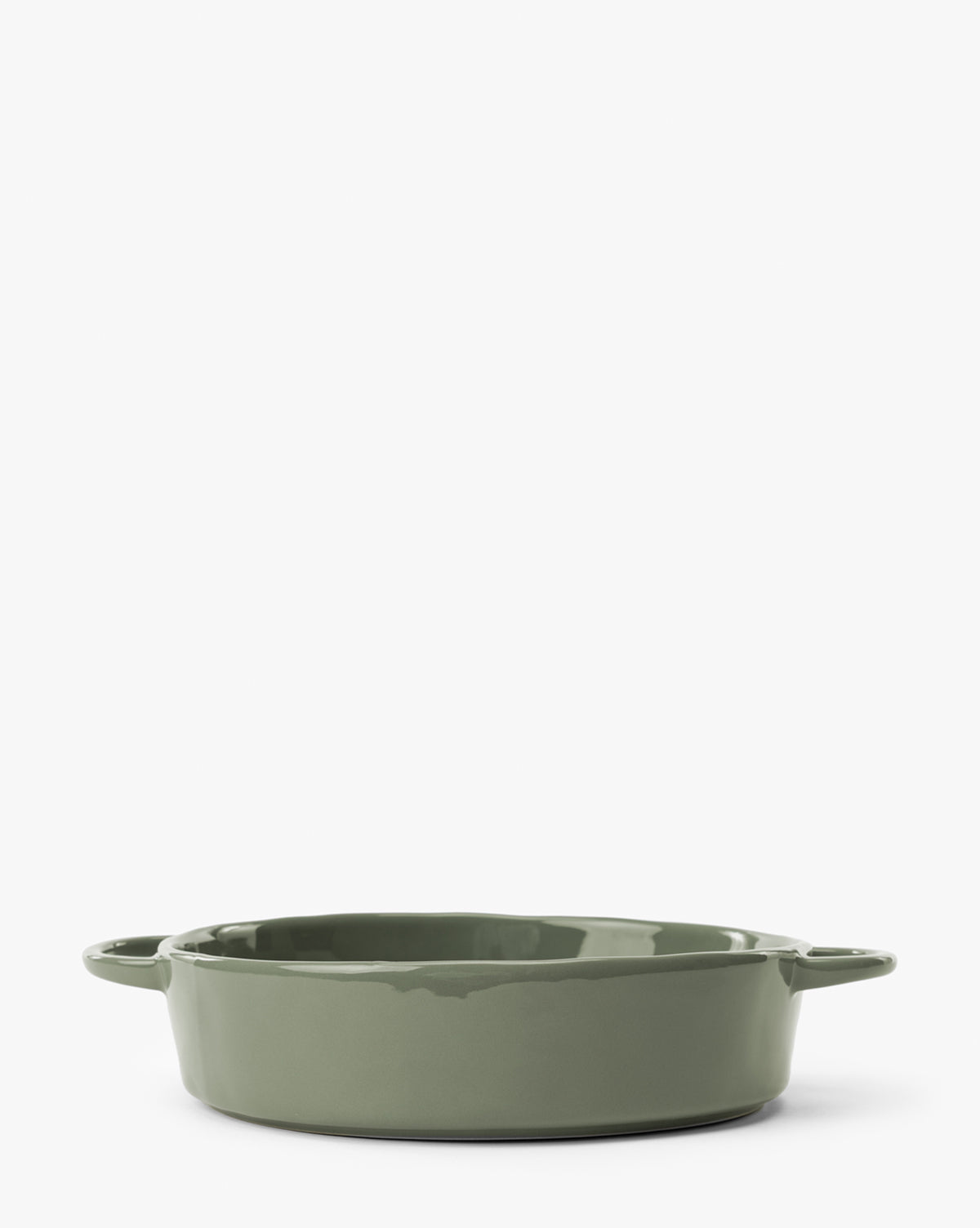 A green 2 Quart Stoneware Baker (Set of 2) with two small handles is shown against a plain white background. The round dish has a glossy finish, by McGee & Co.
