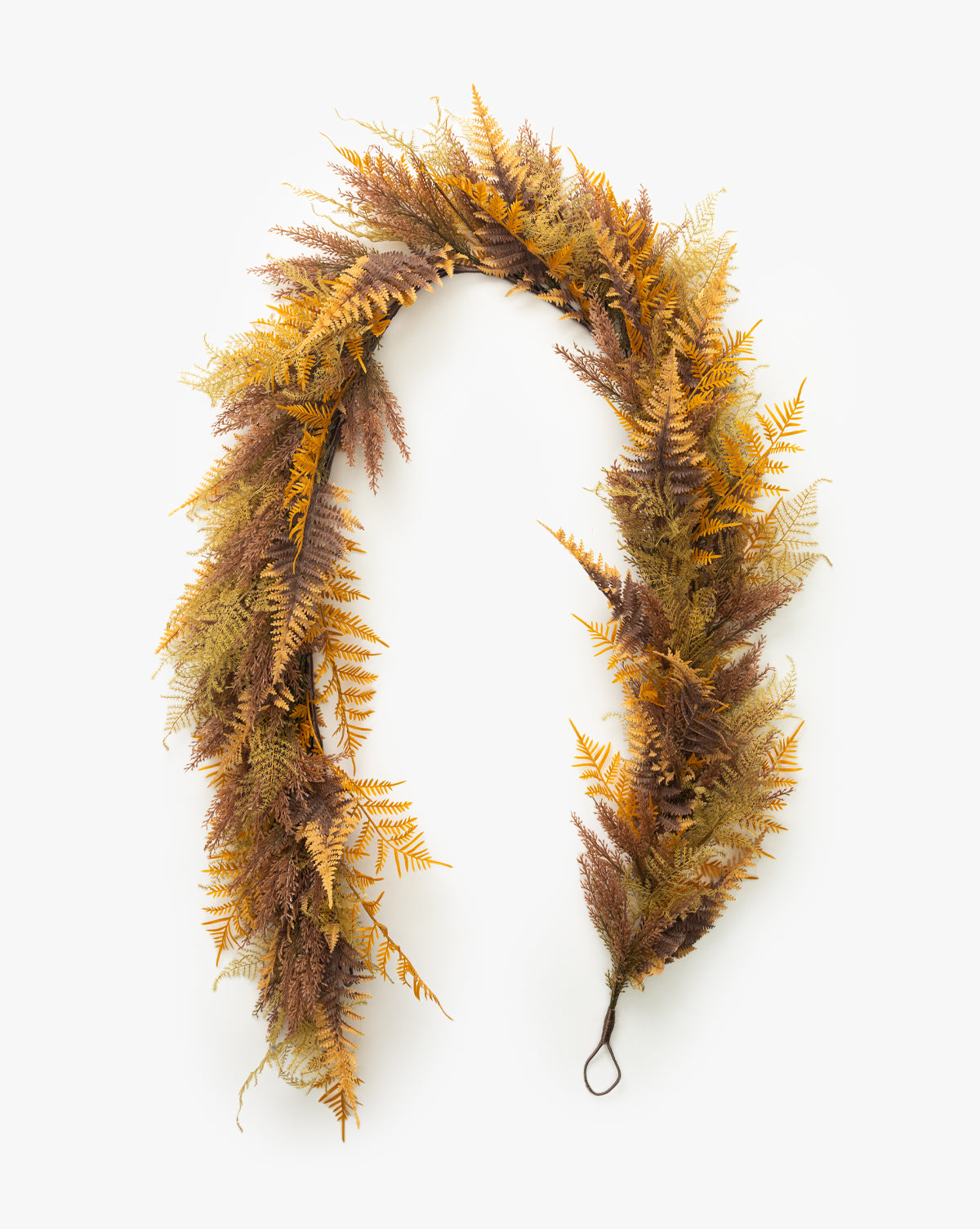 The 6 Faux Golden Fern Garland features amber and golden artificial ferns in yellow, brown, and green, arranged in a curved shape with a loop—ideal for autumn décor against a plain white background by McGee & Co.