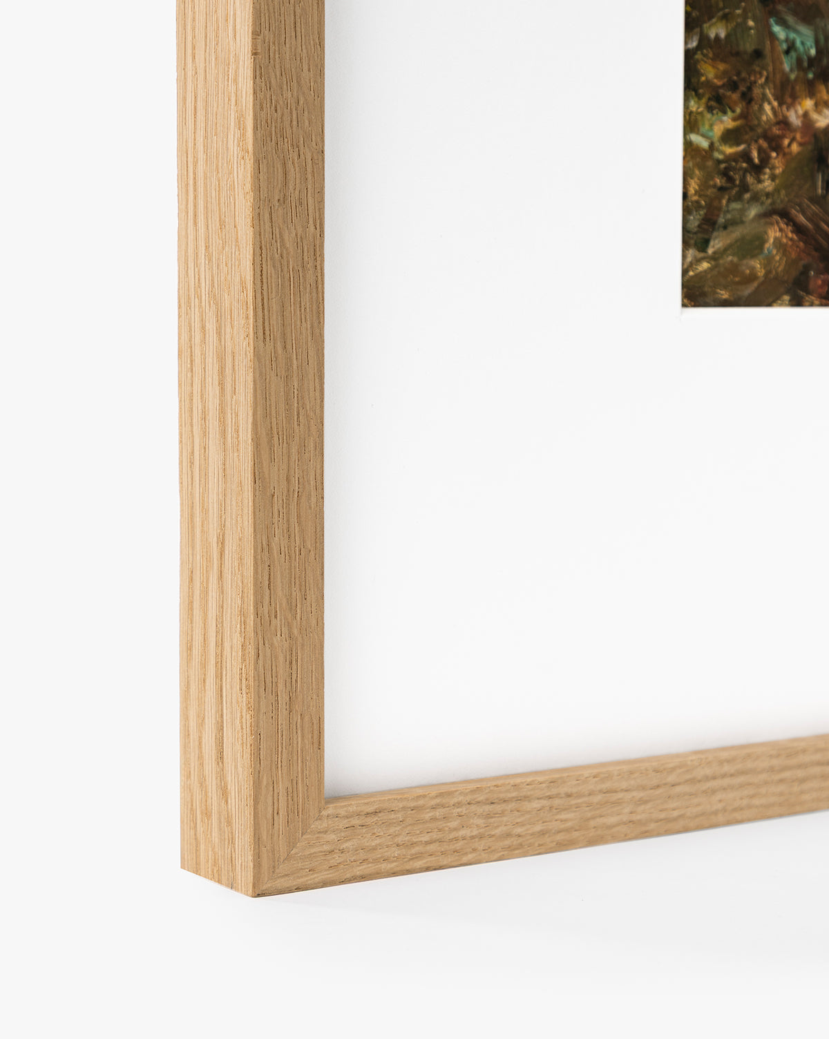 Close-up of the corner of a light wood frame featuring A River Runs Through, an abstract landscape in earthy tones—ideal for adding elegant wall art to your space, by McGee & Co.