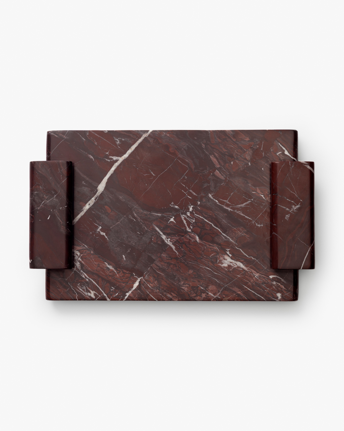 The Auburn Marble Tray, with white veins and two thick rectangular side handles, sits against a white background—ideal as a decorative or serving tray for elegant settings, by McGee & Co.