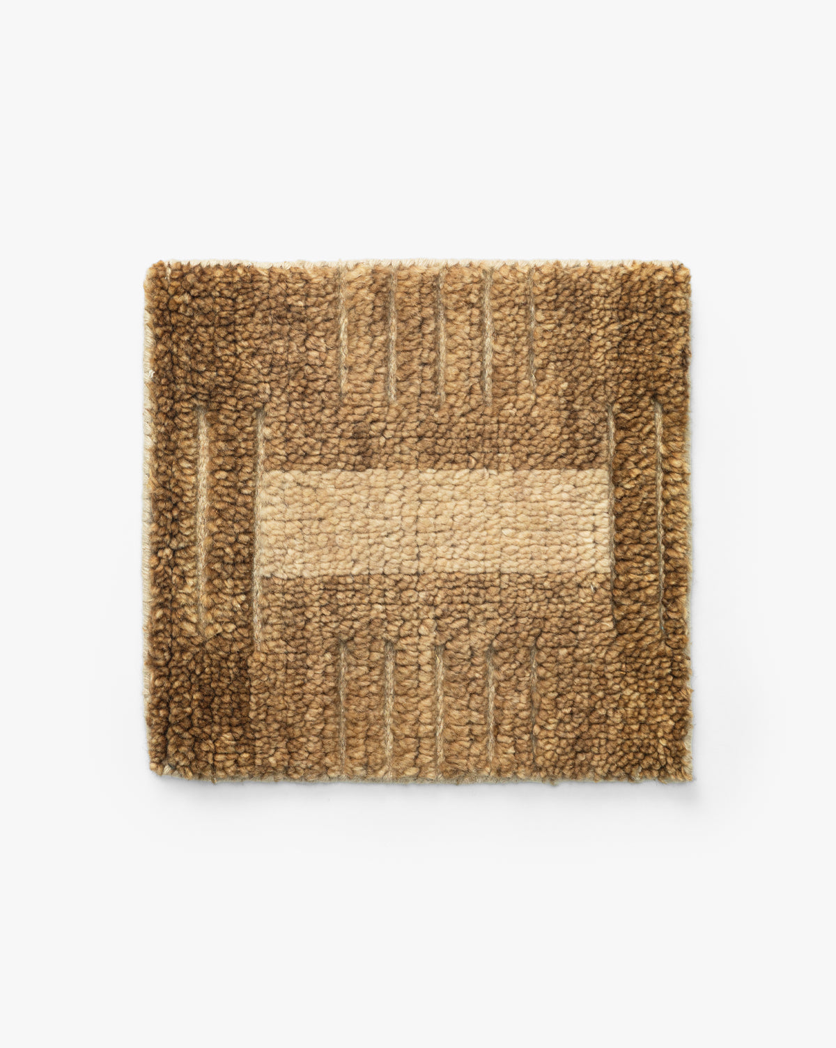 The Brenner Hand-Knotted Rug Swatch is a rectangular, textured wool sample with a geometric checker pattern in various shades of brown and tan. Its soft, looped surface creates a warm, earthy look with symmetrical design elements by McGee & Co.